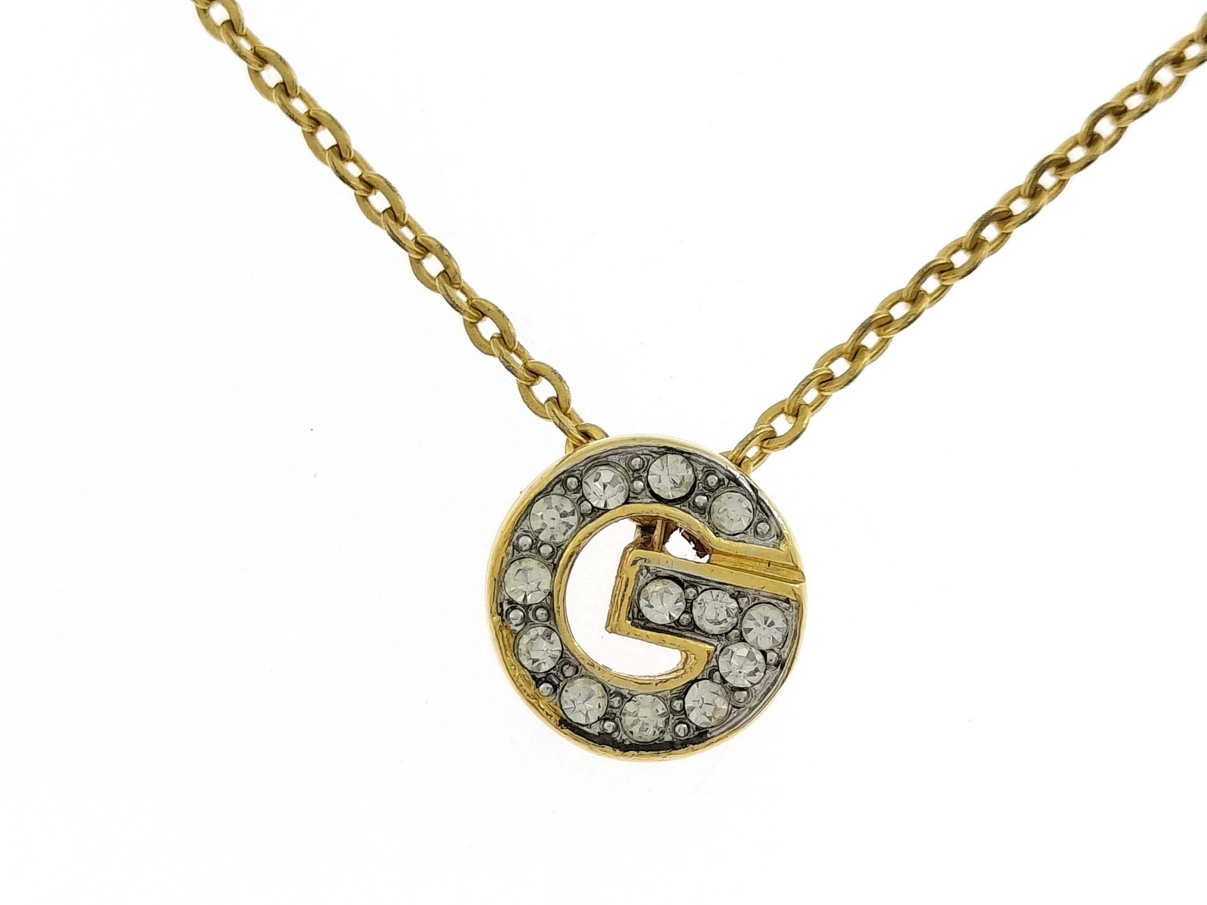 necklace with rhinestones and logo.