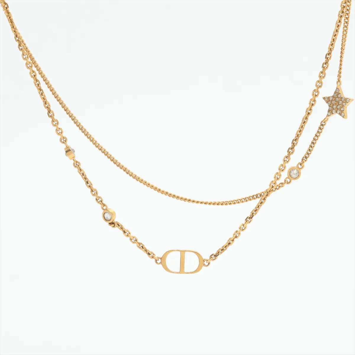 Petit CD necklace, gold-plated with rhinestones. Shows signs of wear,