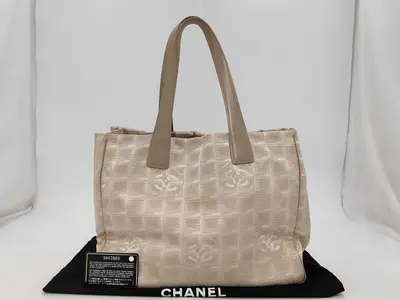New Travel Line Tote PM, with seal and card, serial number in the 9s, includes dust bag.