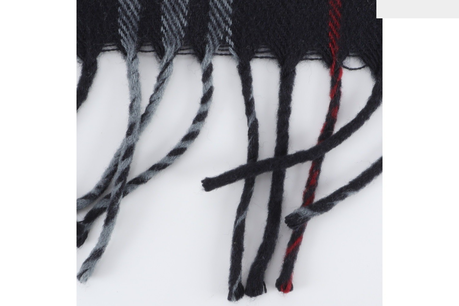 Checkered scarf with tags attached. — view 4