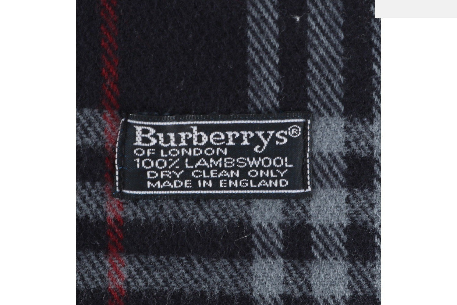 Checkered scarf with tags attached. — view 5