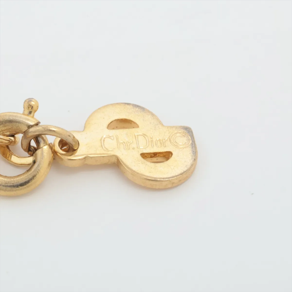 CD logo necklace, gold plated with rhinestones. Shows signs of wear, — view 4