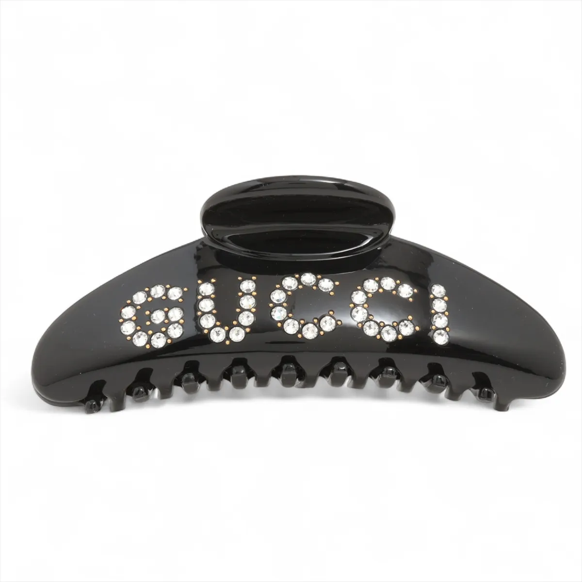 logo hair clip, resin x rhinestones, black. Shows signs of wear,