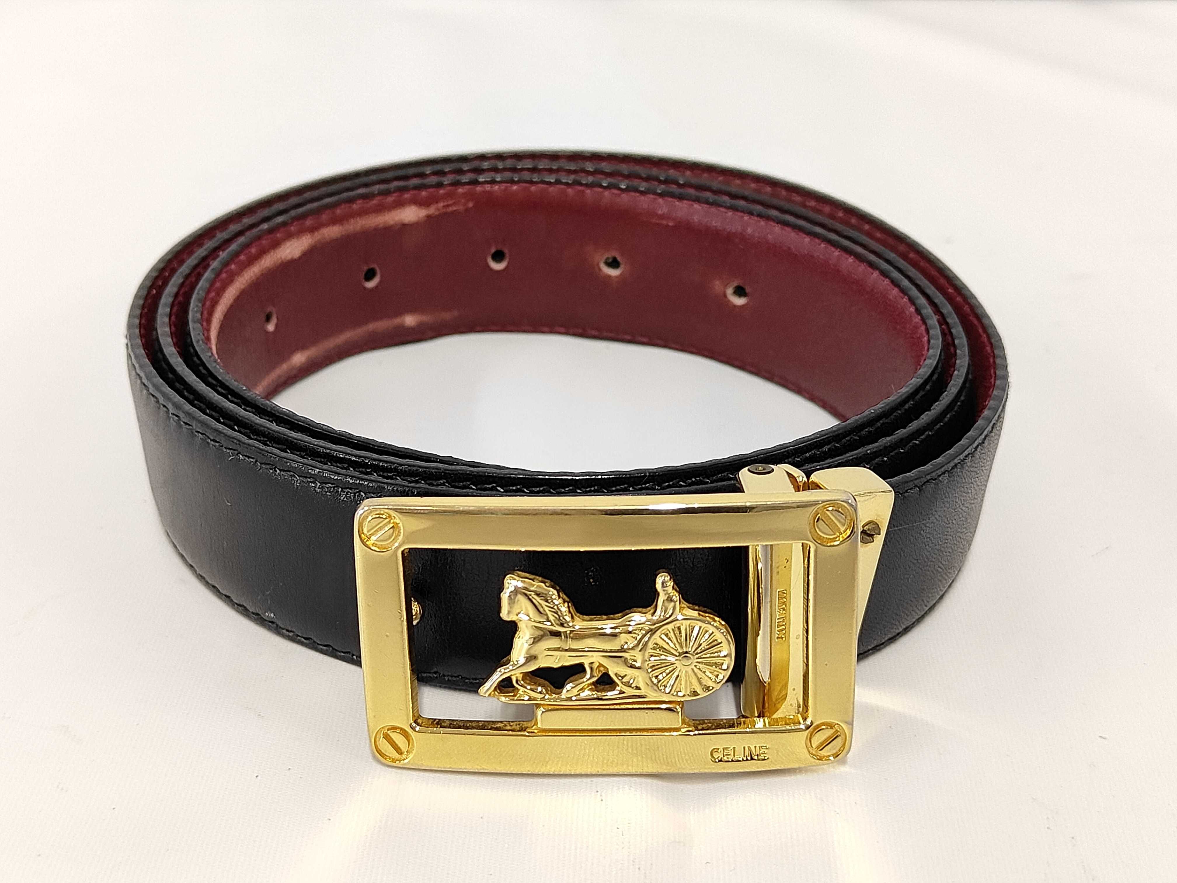 leather belt with carriage hardware.