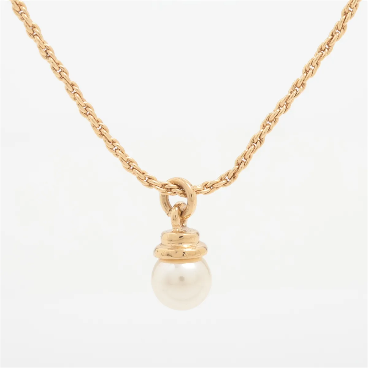 necklace, gold plated with faux pearls. Shows wear, tarnishing, and discoloration. — view 2