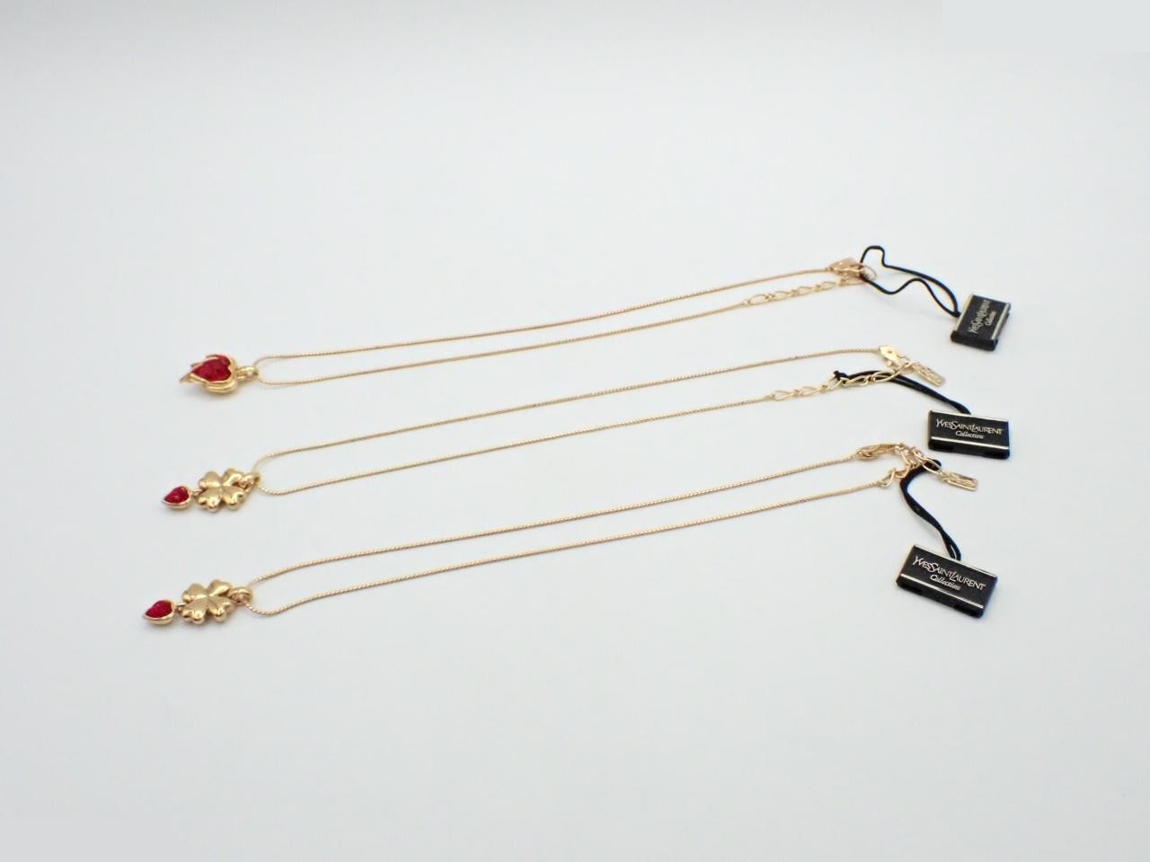 Four accessories: 3 necklaces and 1 pair of earrings. — view 2