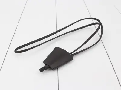 Leather clochette, long type, with loop closure and embossed interior.