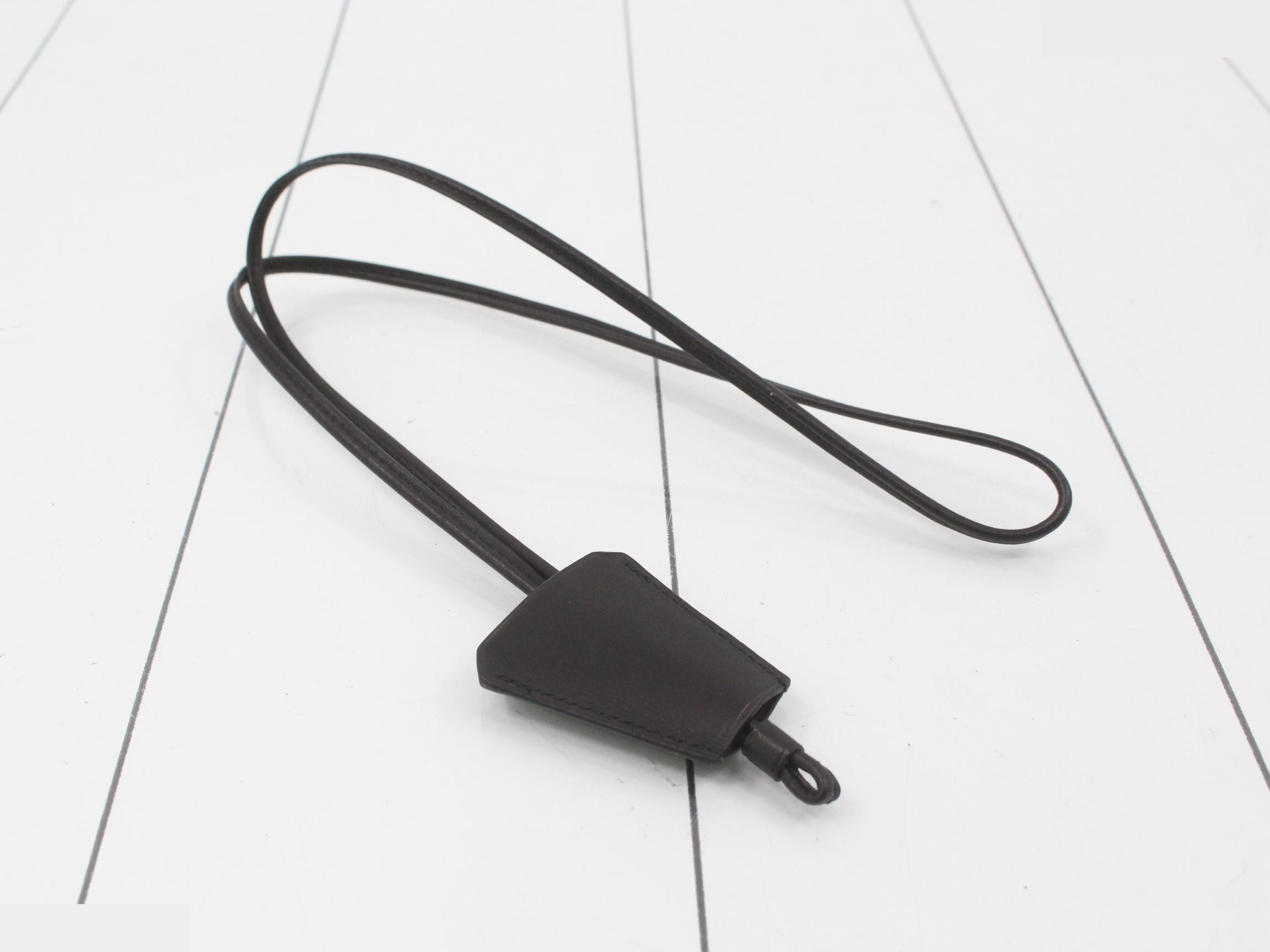 Leather clochette, long type, with loop closure and embossed interior. — view 2