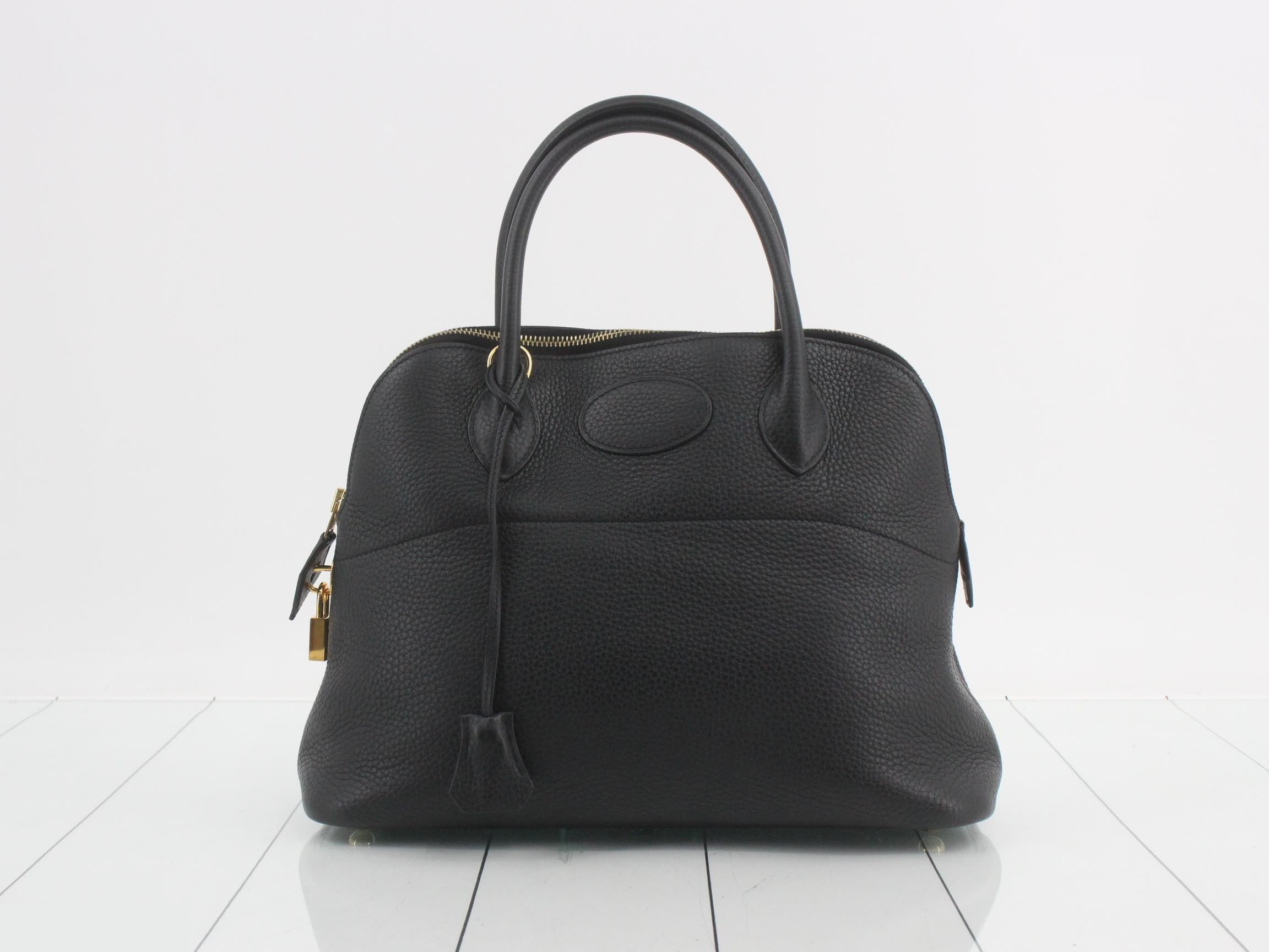 Bolide handbag, black, with gold hardware.