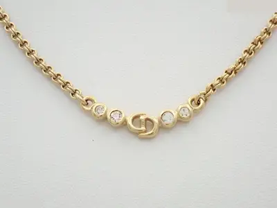 Gold necklace with stone, chain approximately 42cm long.