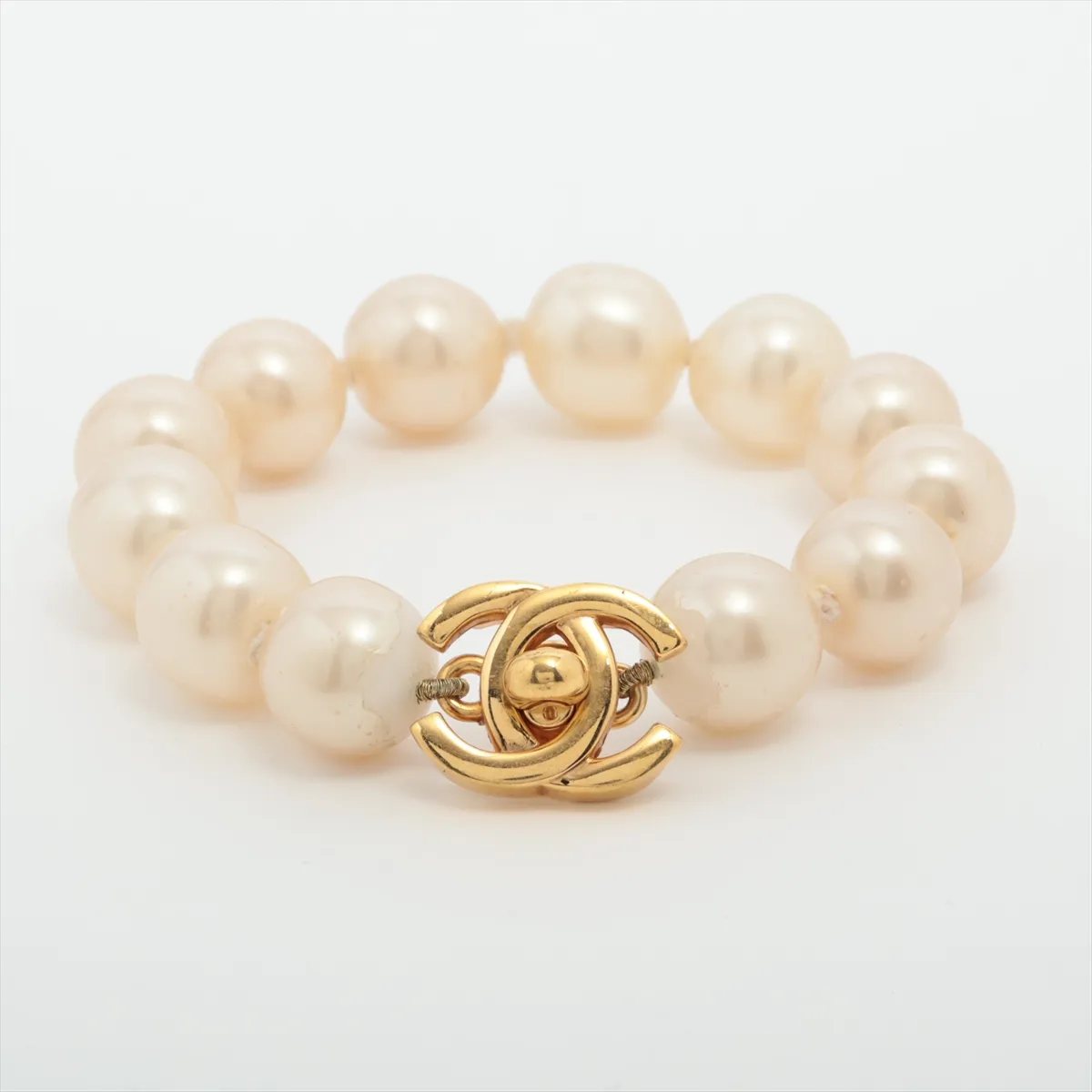 Coco Mark Turnlock 96P Bracelet, GP x Faux Pearl. Shows signs of wear including