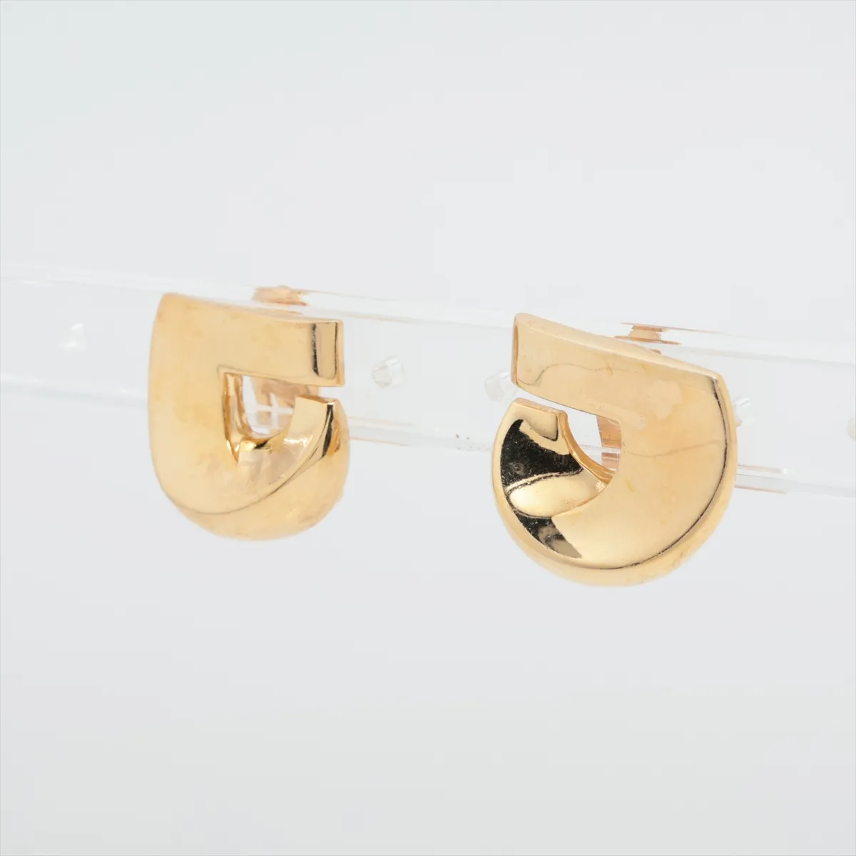 logo earrings (for both ears), GP gold. Shows signs of wear, — view 3