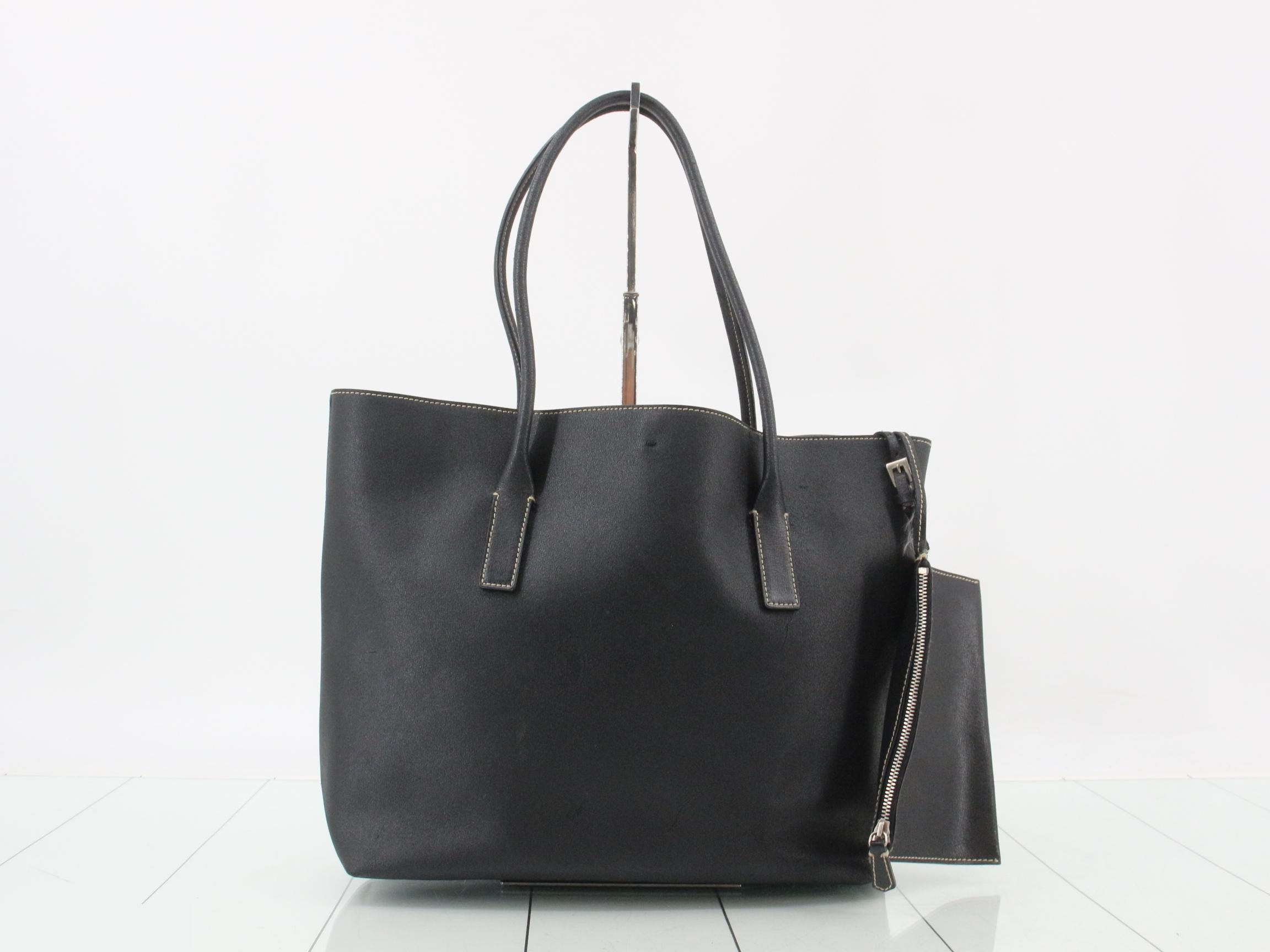 Leather tote bag with triangular plate and pouch, black.