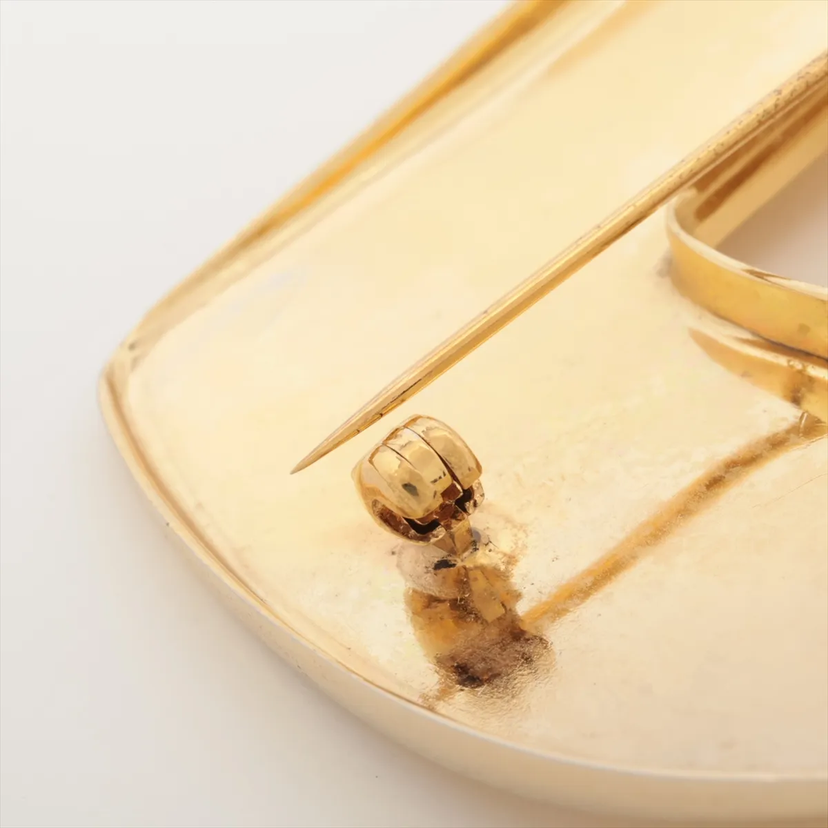 logo brooch, GP gold. Shows signs of wear, including — view 3