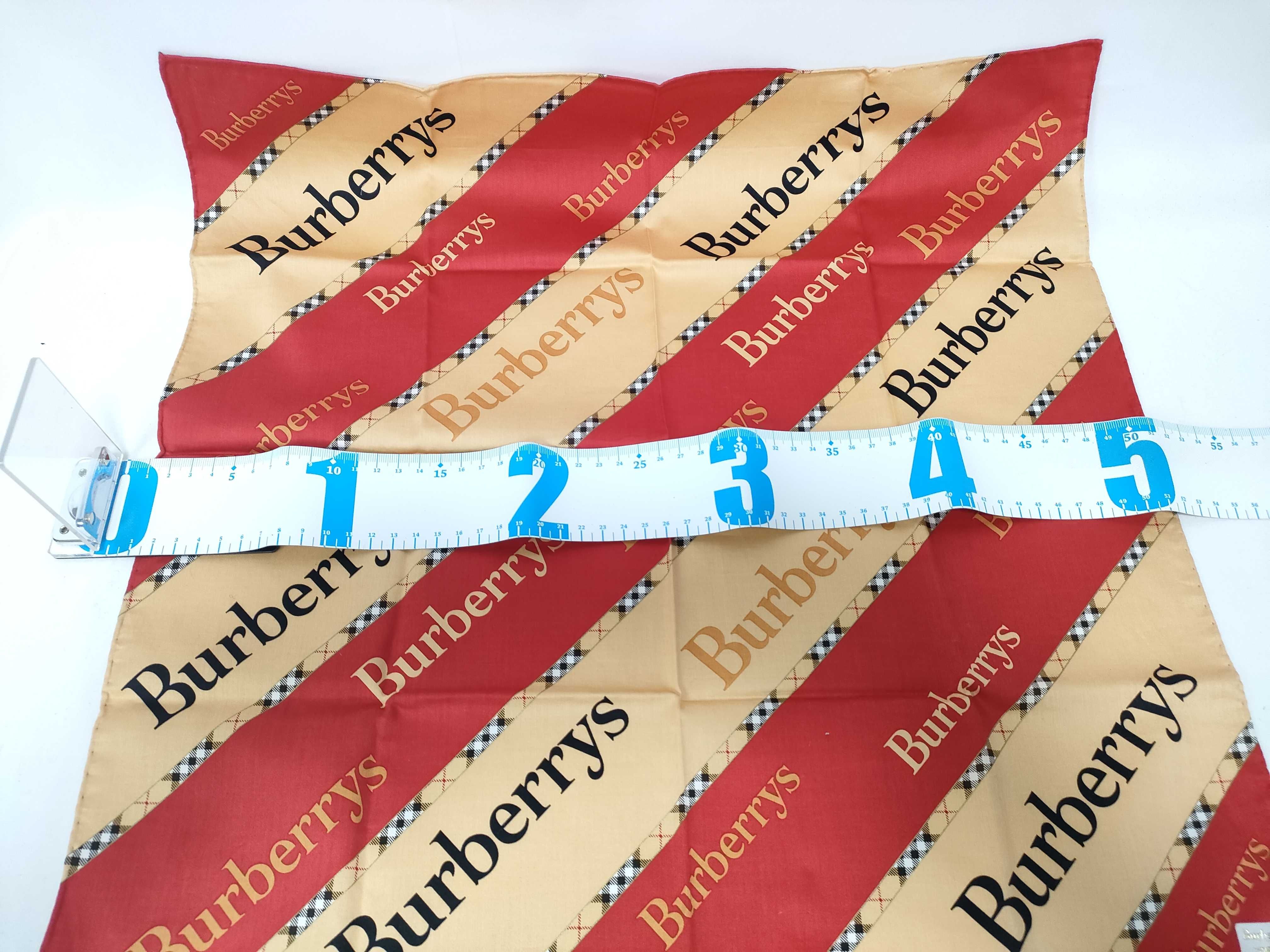 handkerchief/scarf with sticker, logo print, beige/red, and other accessories. — view 2