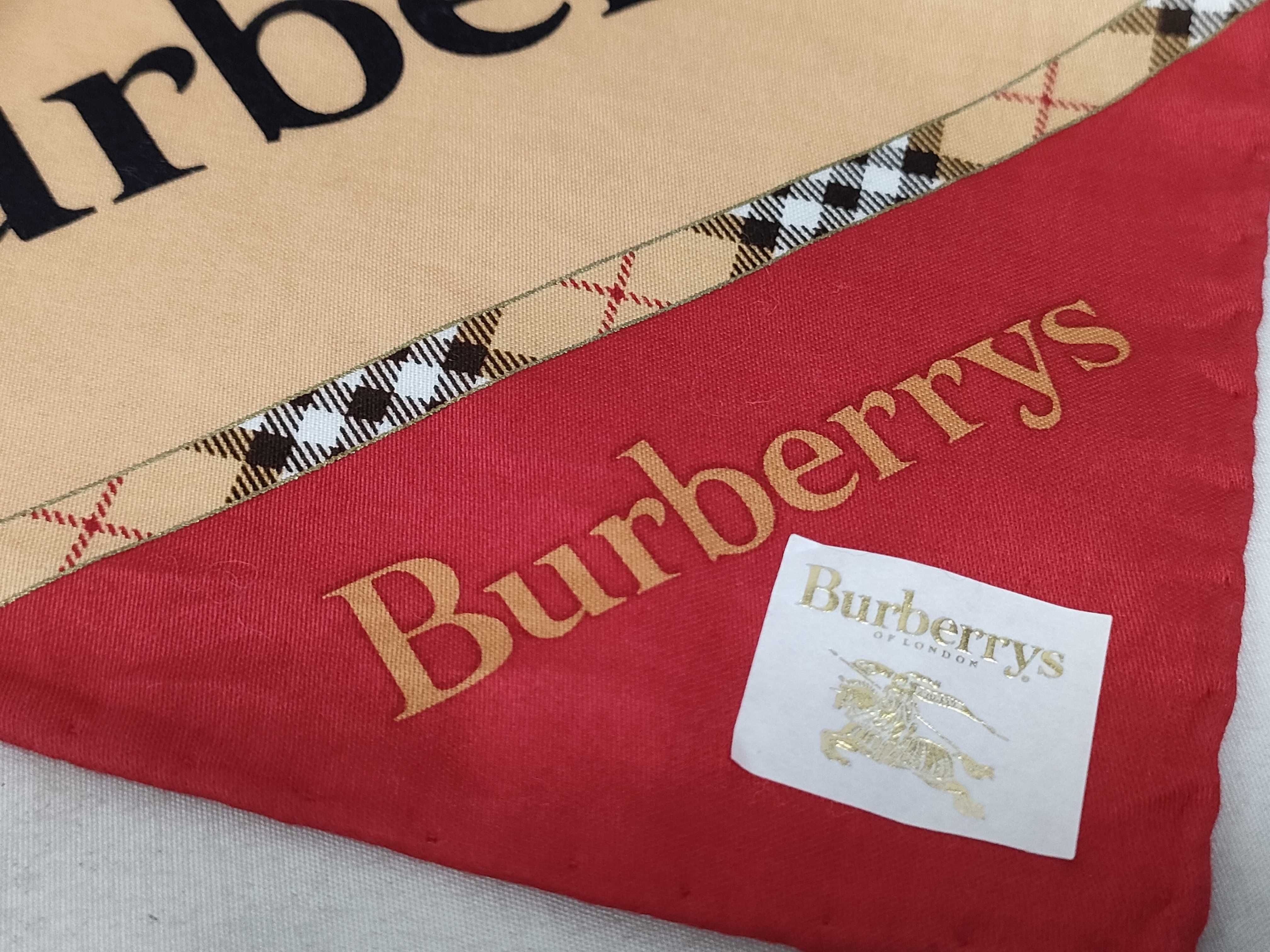handkerchief/scarf with sticker, logo print, beige/red, and other accessories. — view 3