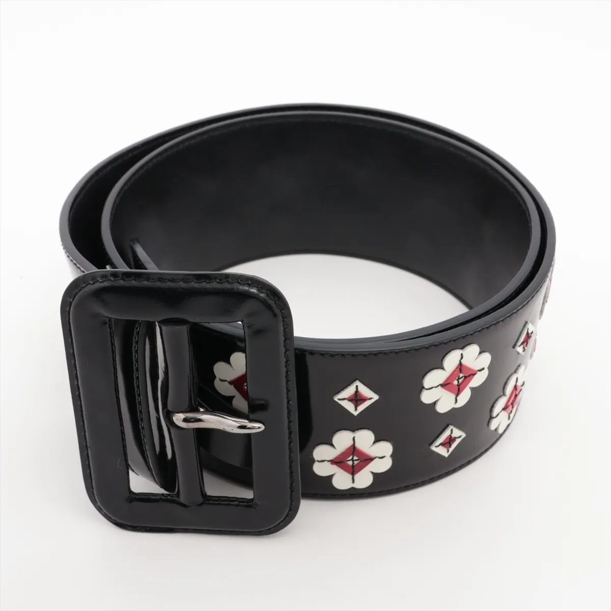 belt, size 85, leather and patent leather, black. Shows signs of wear, including