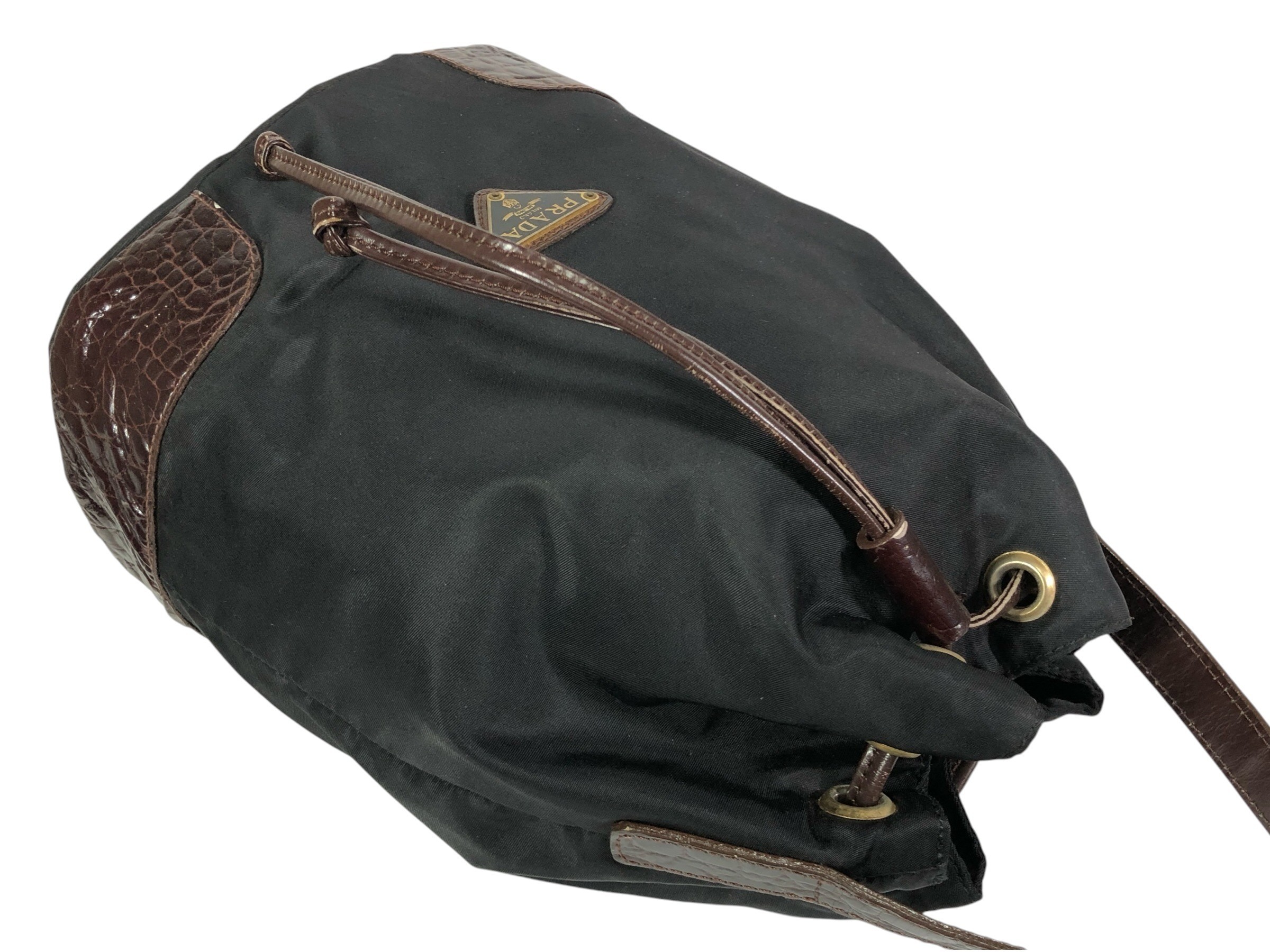 drawstring shoulder bag with triangular logo plate and crocodile embossed leather. — view 7