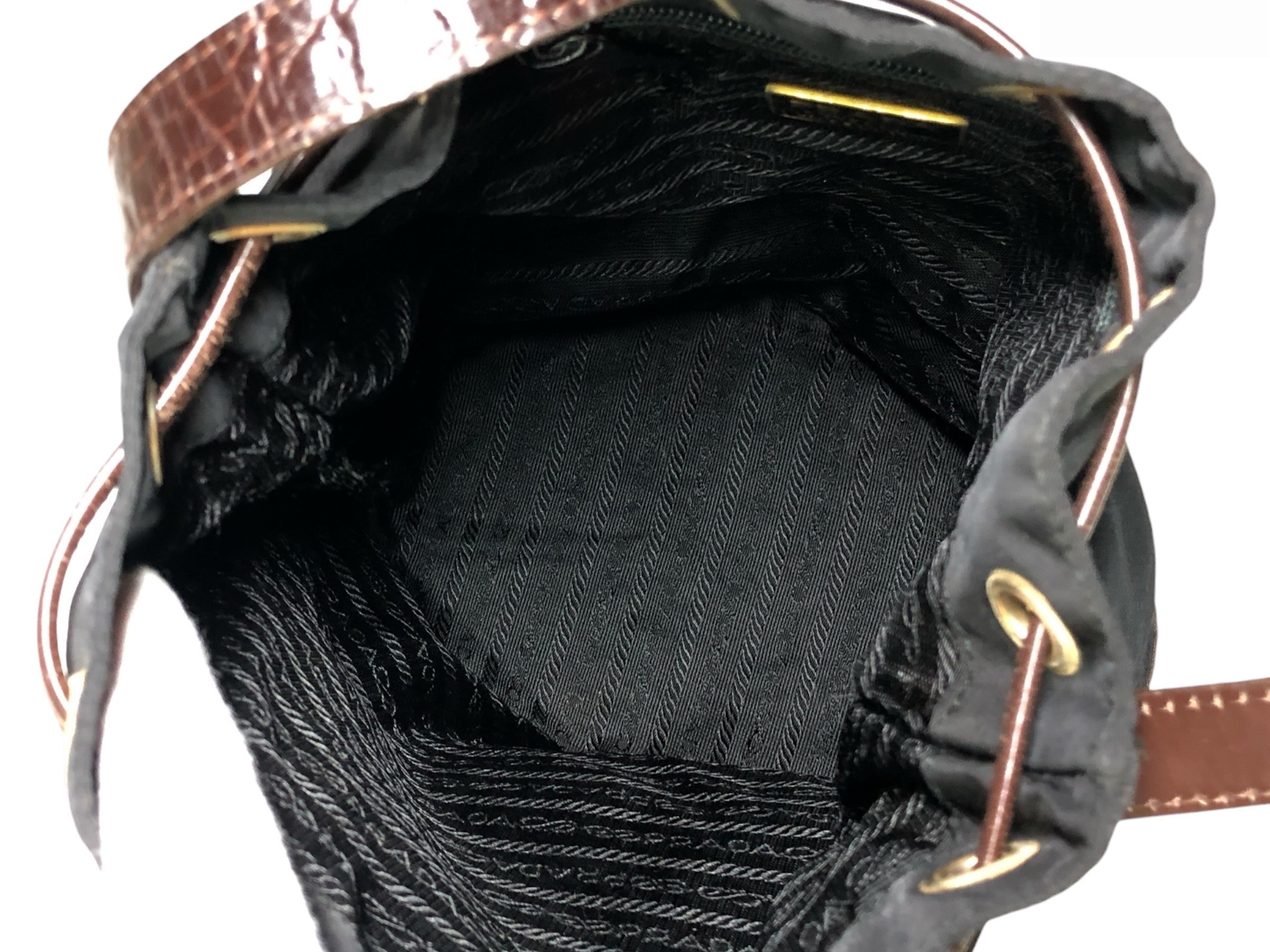 drawstring shoulder bag with triangular logo plate and crocodile embossed leather. — view 9