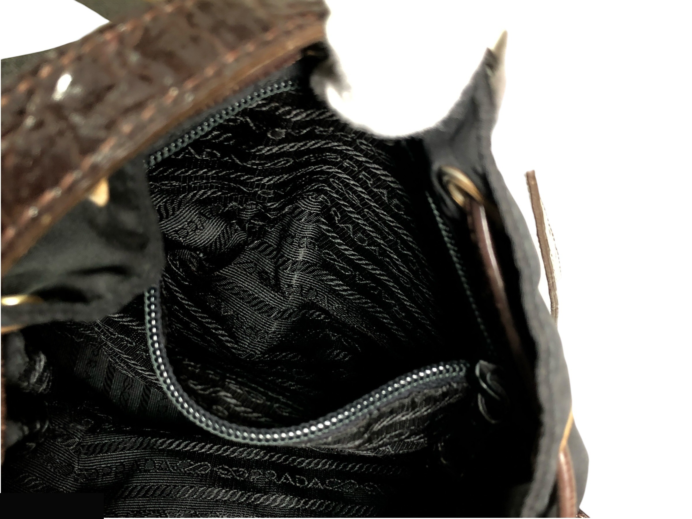 drawstring shoulder bag with triangular logo plate and crocodile embossed leather. — view 10
