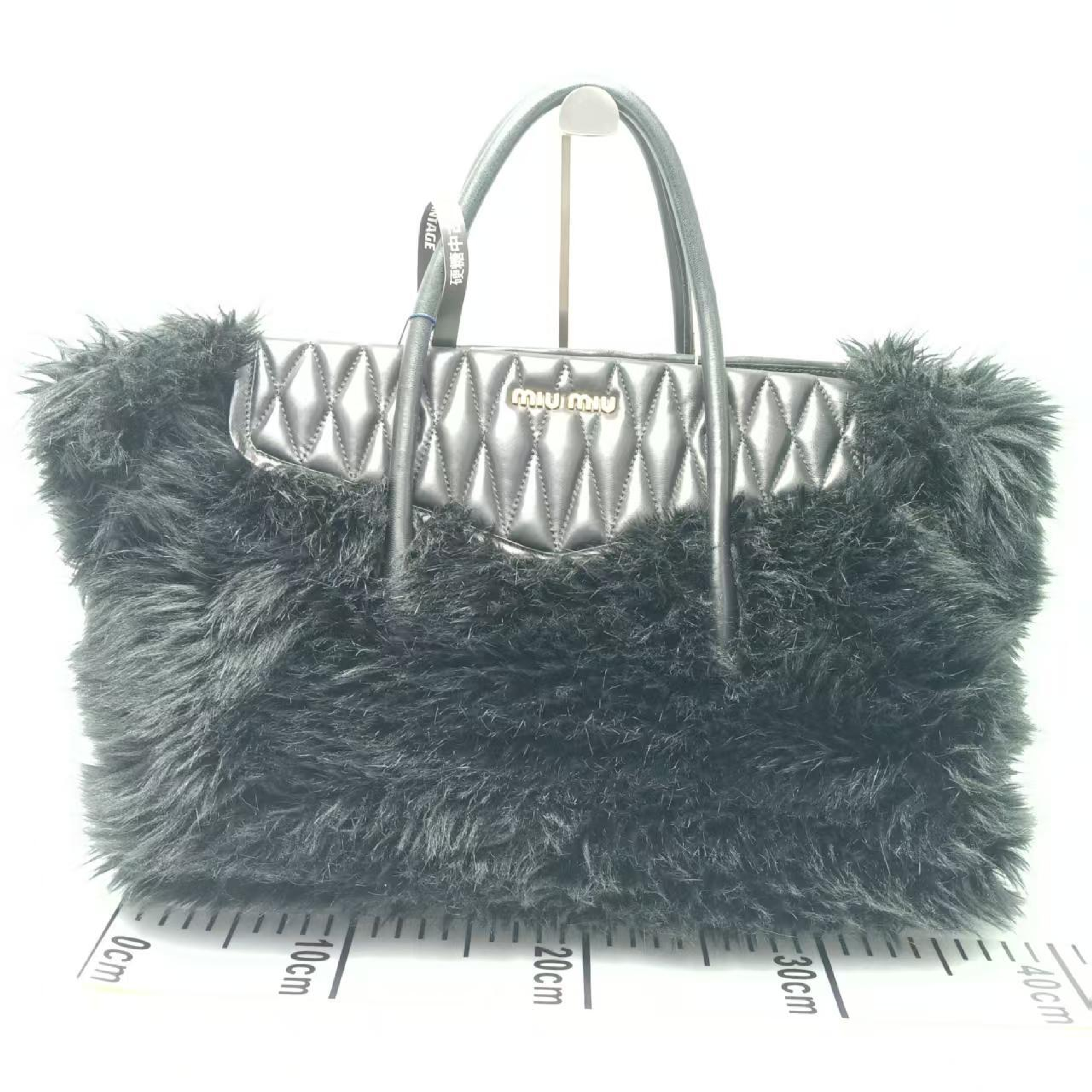 other line sheepskin handbag