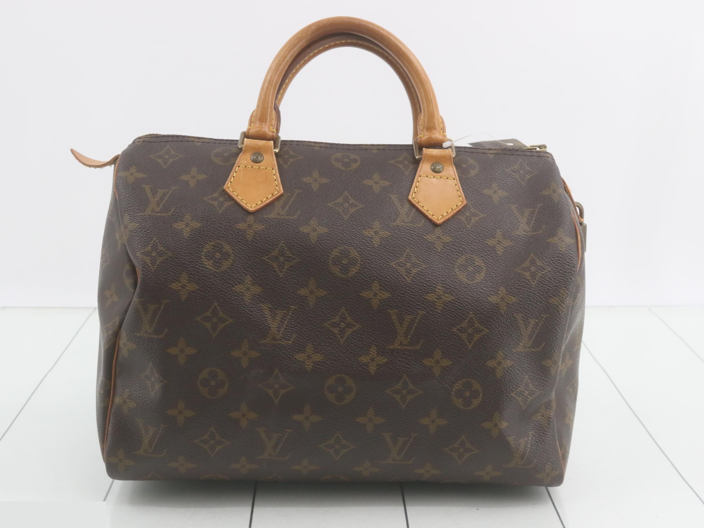 Monogram Speedy 25 Prunen leather tear