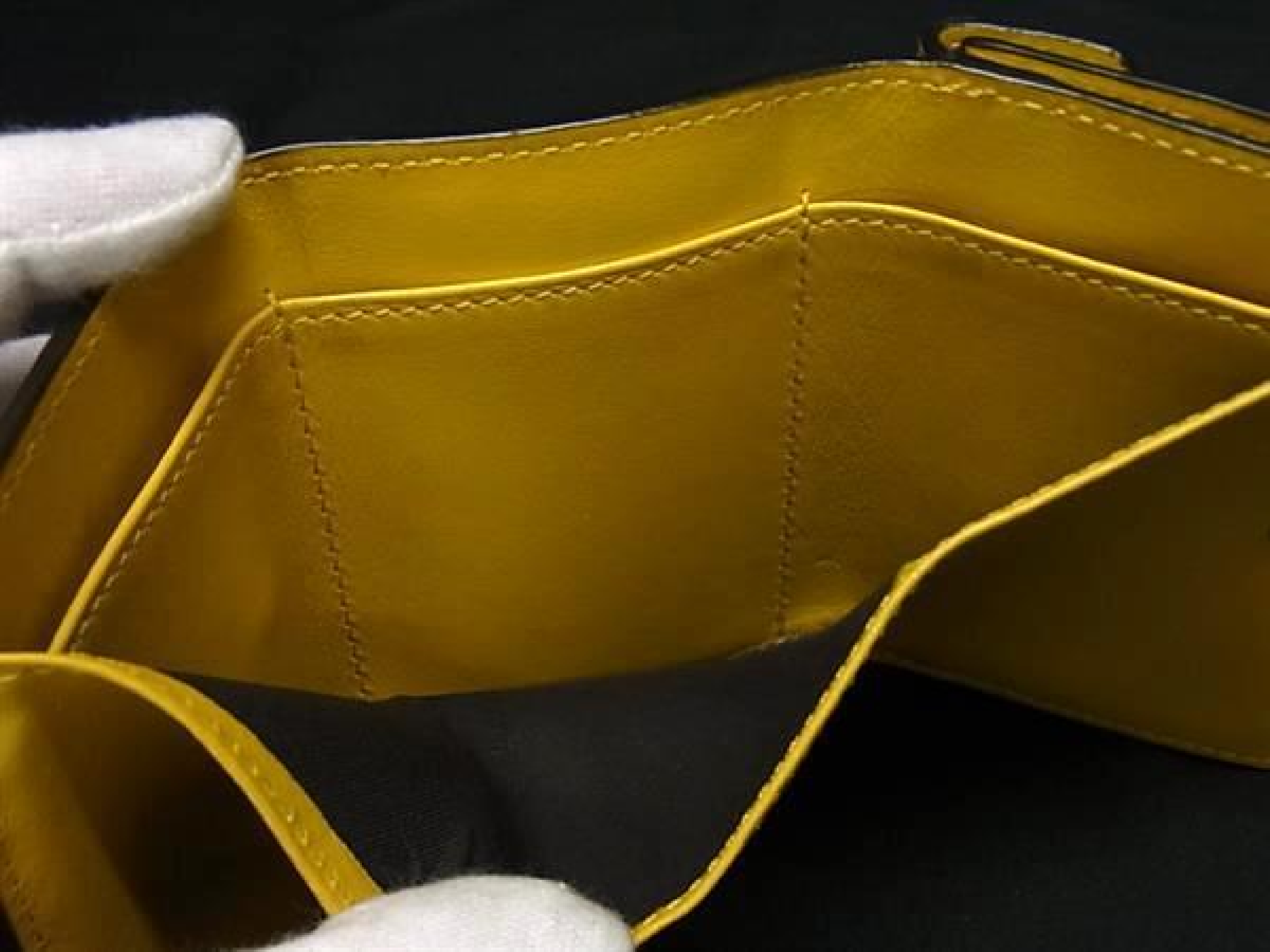 Zucca pattern F is leather trifold wallet with coin purse, bill compartment, and card slots, yellow and brown tones, HD0312. — view 5