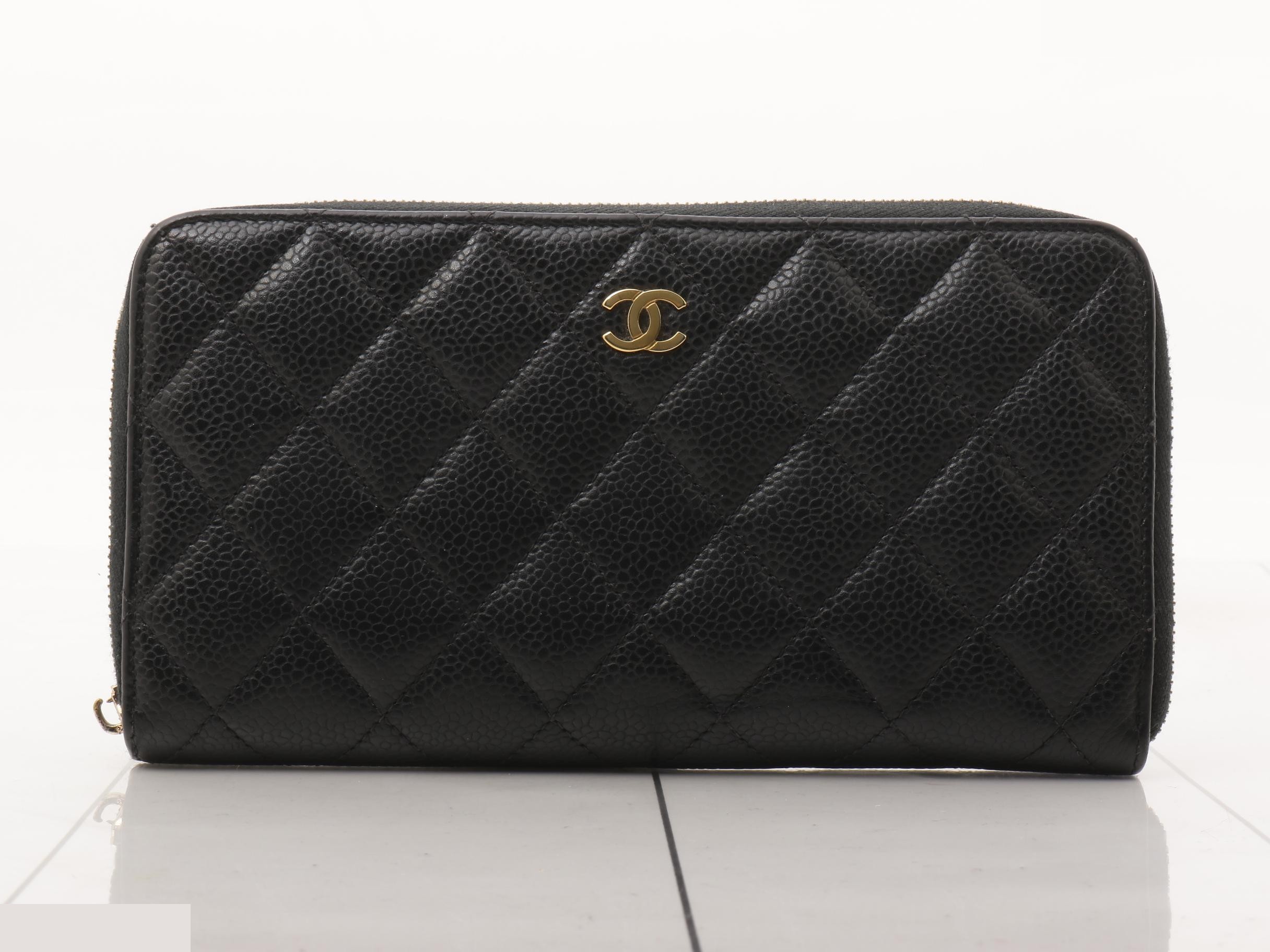 Caviar leather zip-around long wallet, serial number 31, with card and sticker.