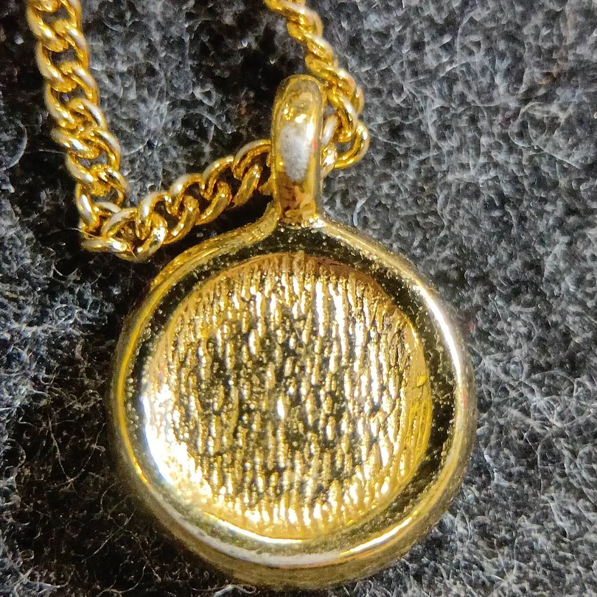 CD logo necklace, gold plated with rhinestones. Shows signs of wear, including — view 6