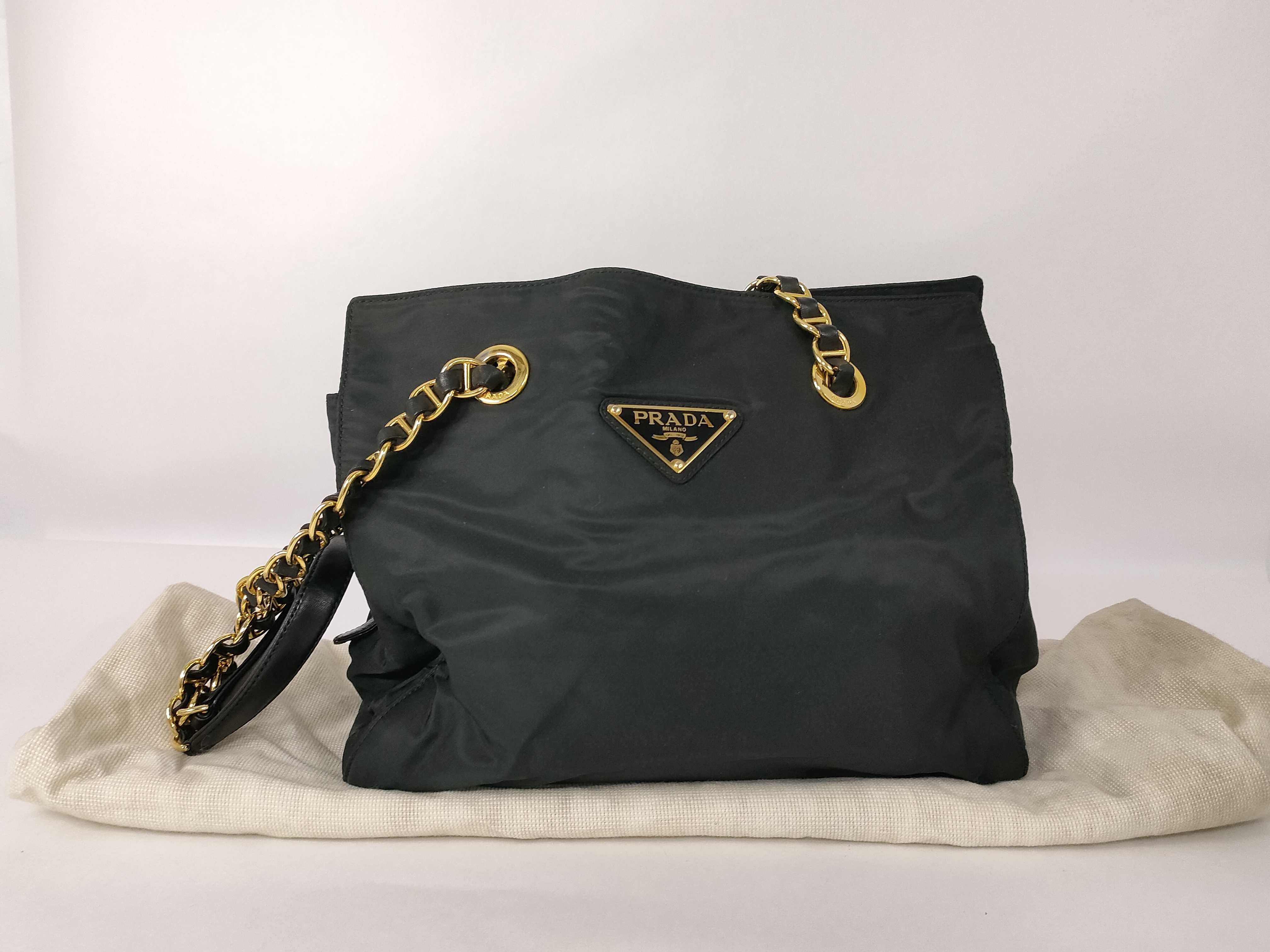 nylon chain tote bag with triangular logo.