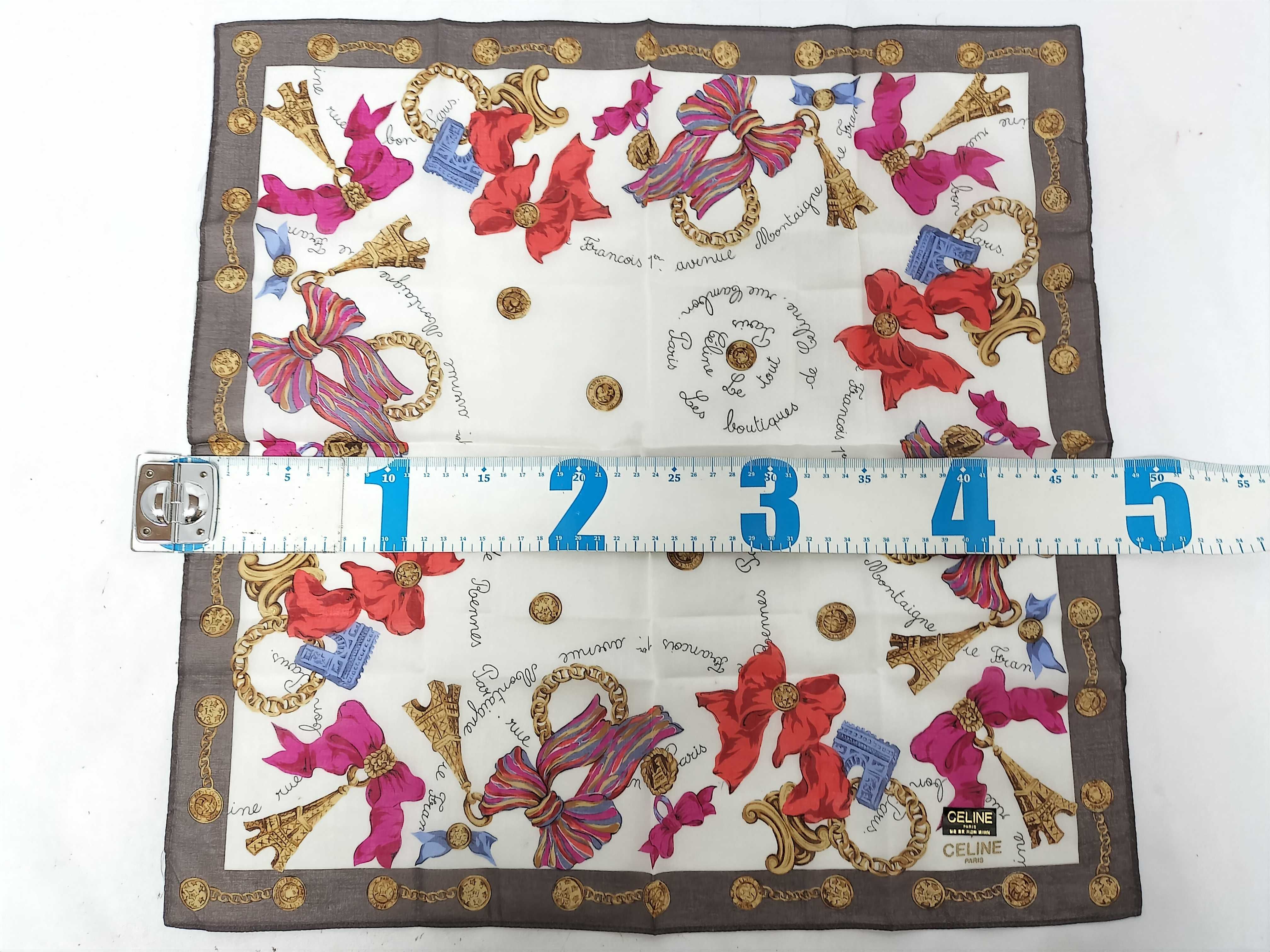 handkerchief scarf with sticker, ribbon, and other accessories. — view 2