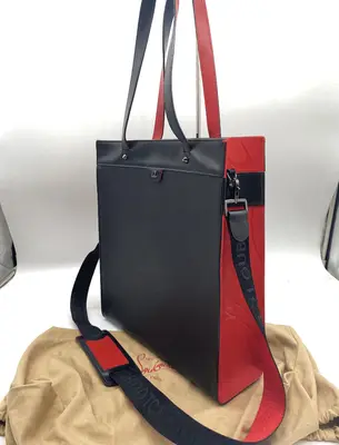 tote bag with strap. Comes with dust bag.