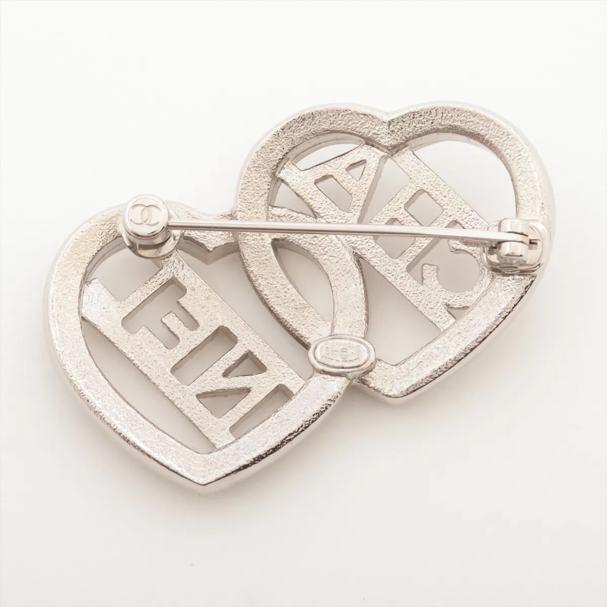 logo brooch C23N, gold plated with rhinestones, silver. Shows signs of wear, including — view 2