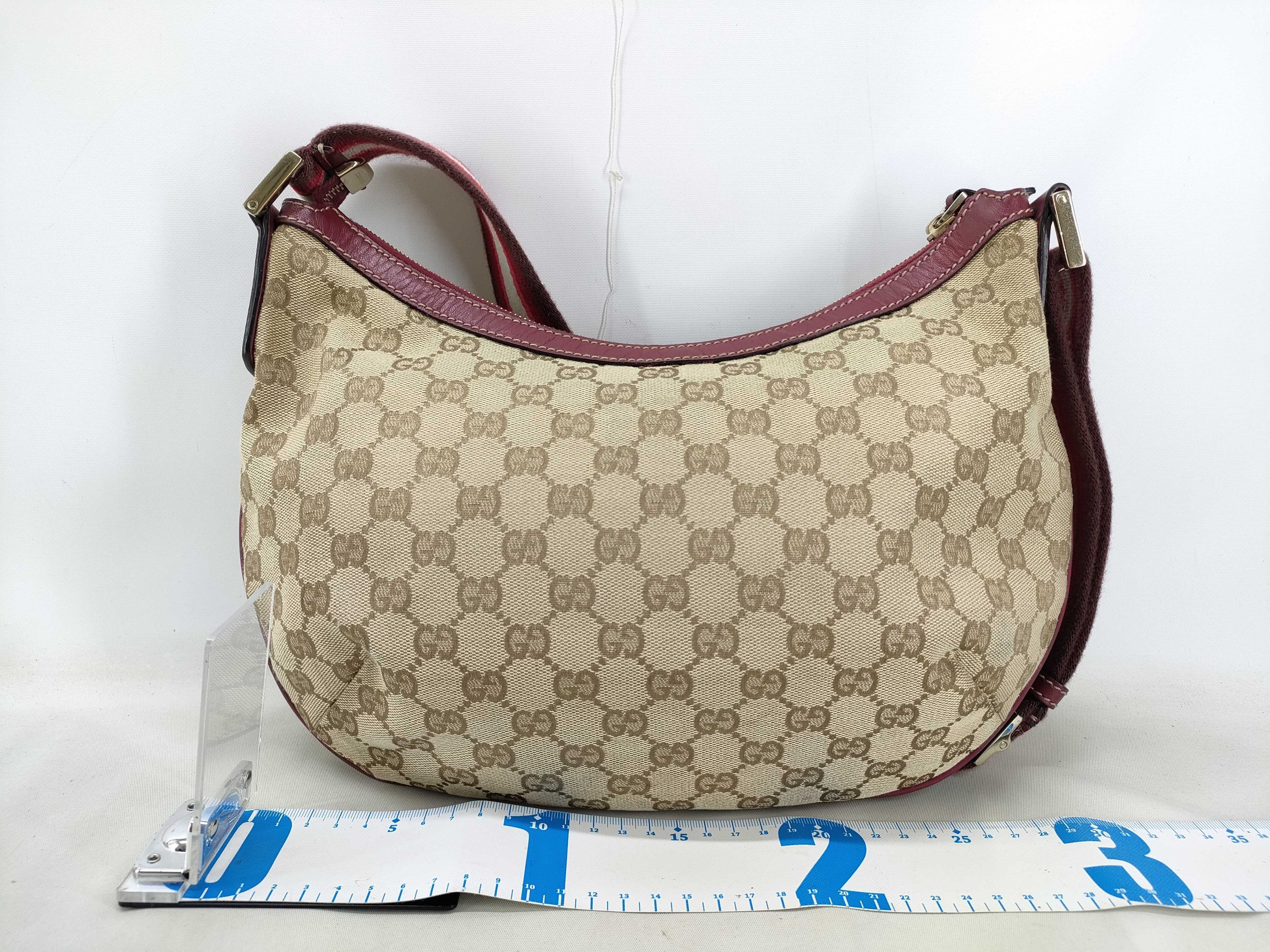 GG Canvas Shoulder Bag with GG Pattern, Webbing Strap, and Leather Trim. — view 2