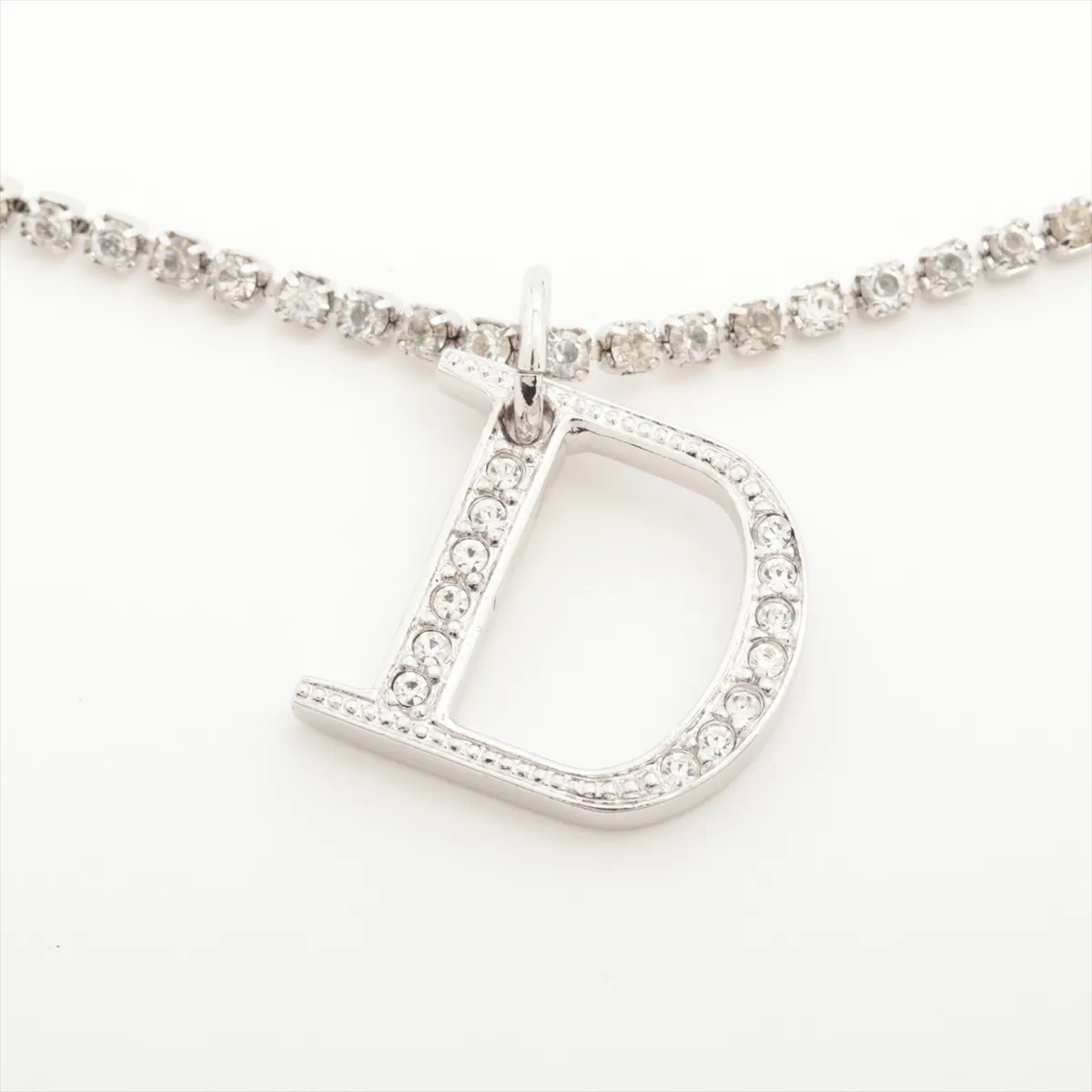 D-logo bracelet, metal and rhinestones, silver. Shows wear, tarnishing, and stains. — view 2