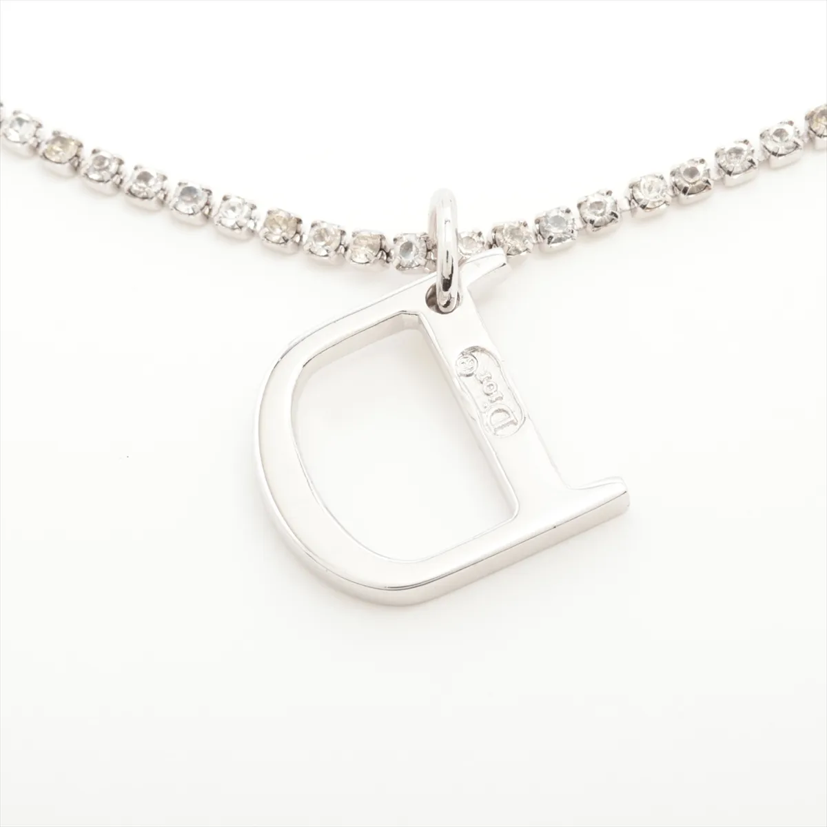 D-logo bracelet, metal and rhinestones, silver. Shows wear, tarnishing, and stains. — view 3