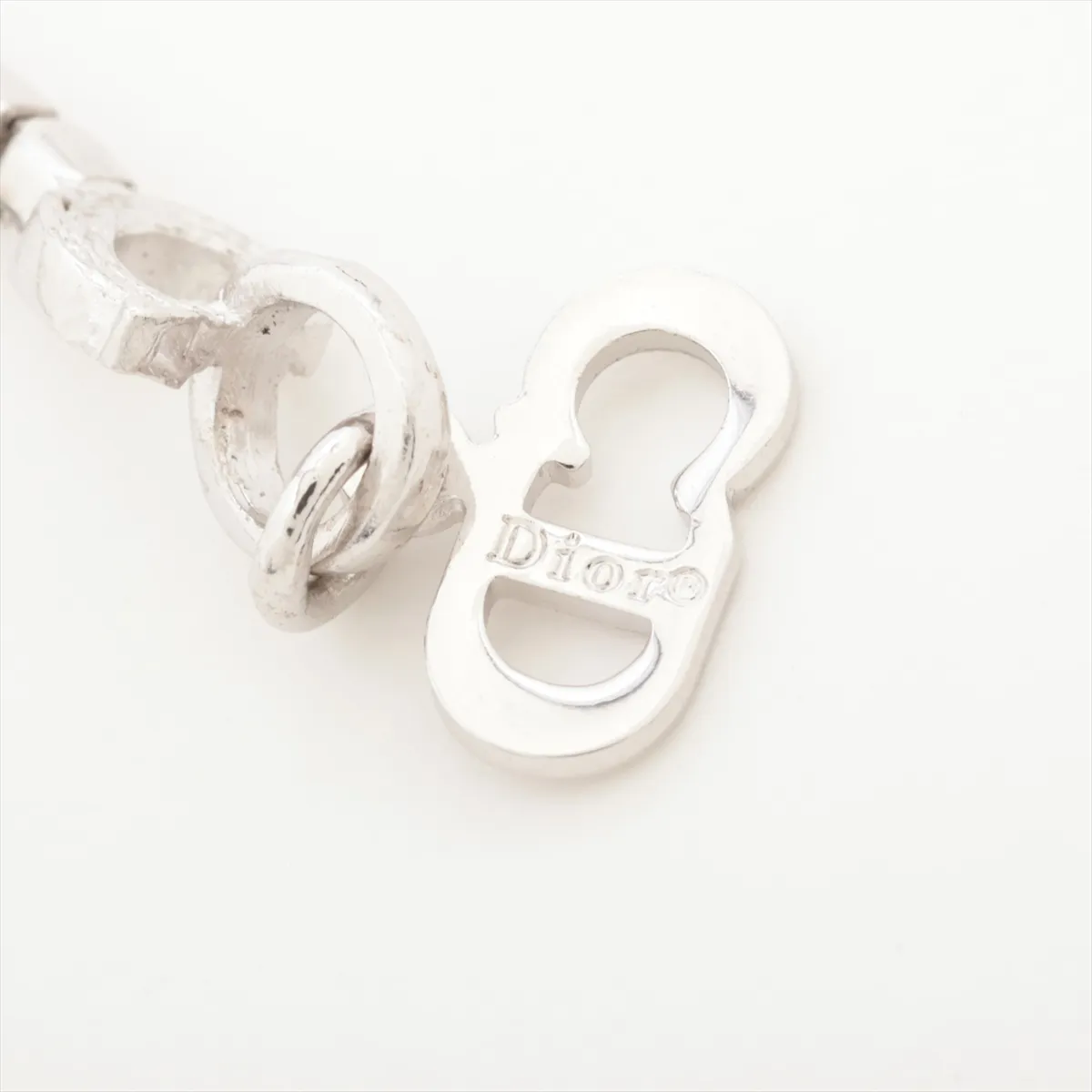 D-logo bracelet, metal and rhinestones, silver. Shows wear, tarnishing, and stains. — view 5