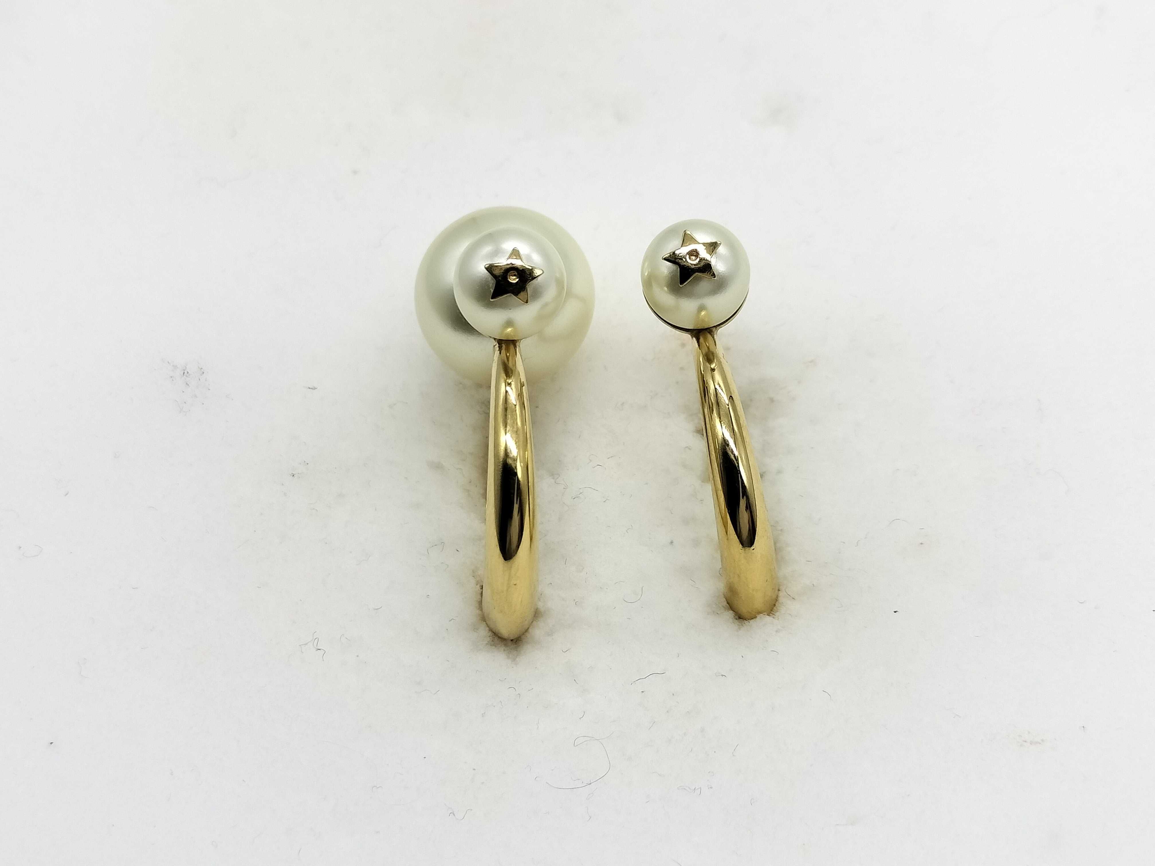 pearl earrings (one earring missing a pearl)