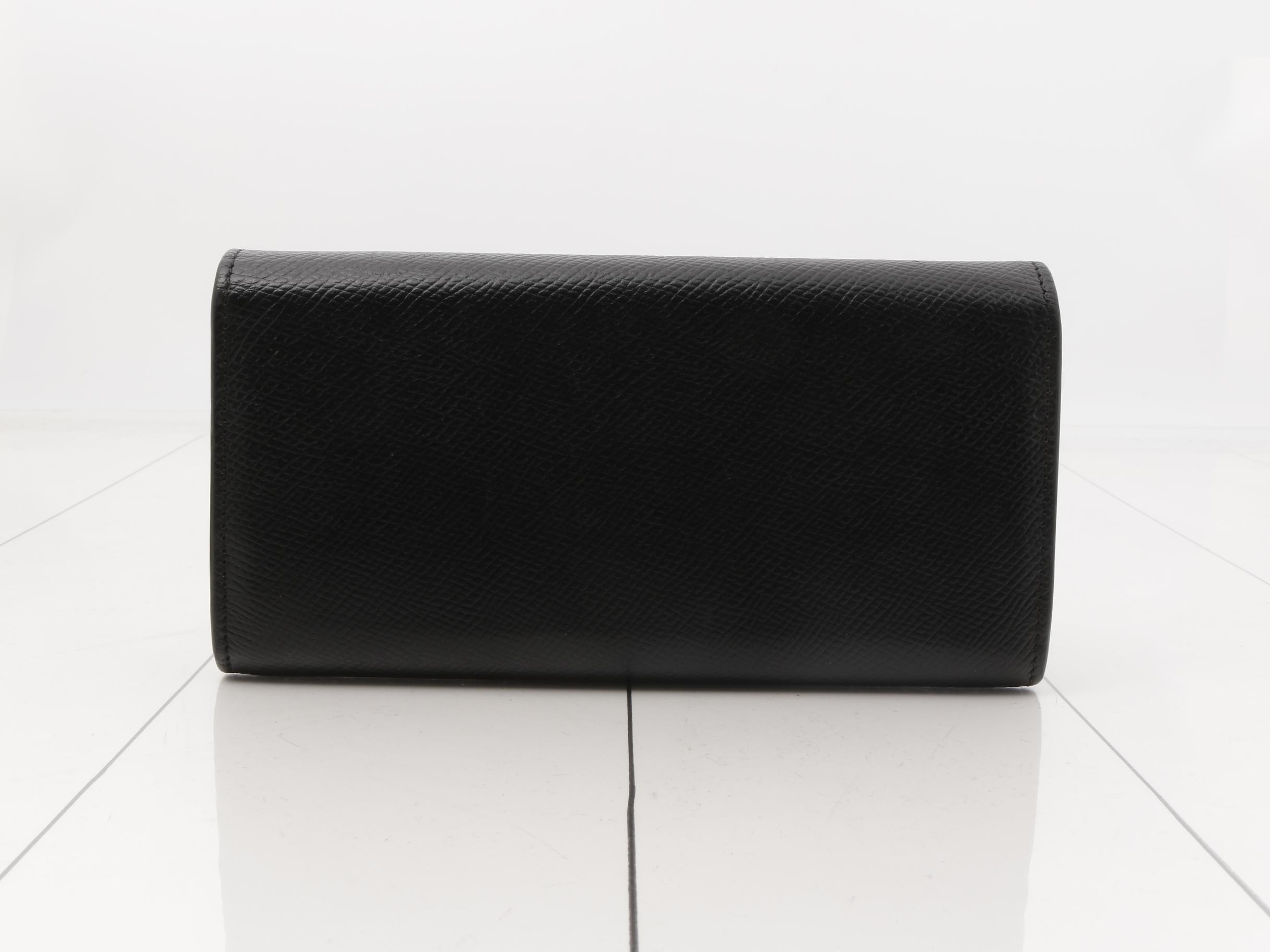 Black bag and wallet with gold hardware. — view 2