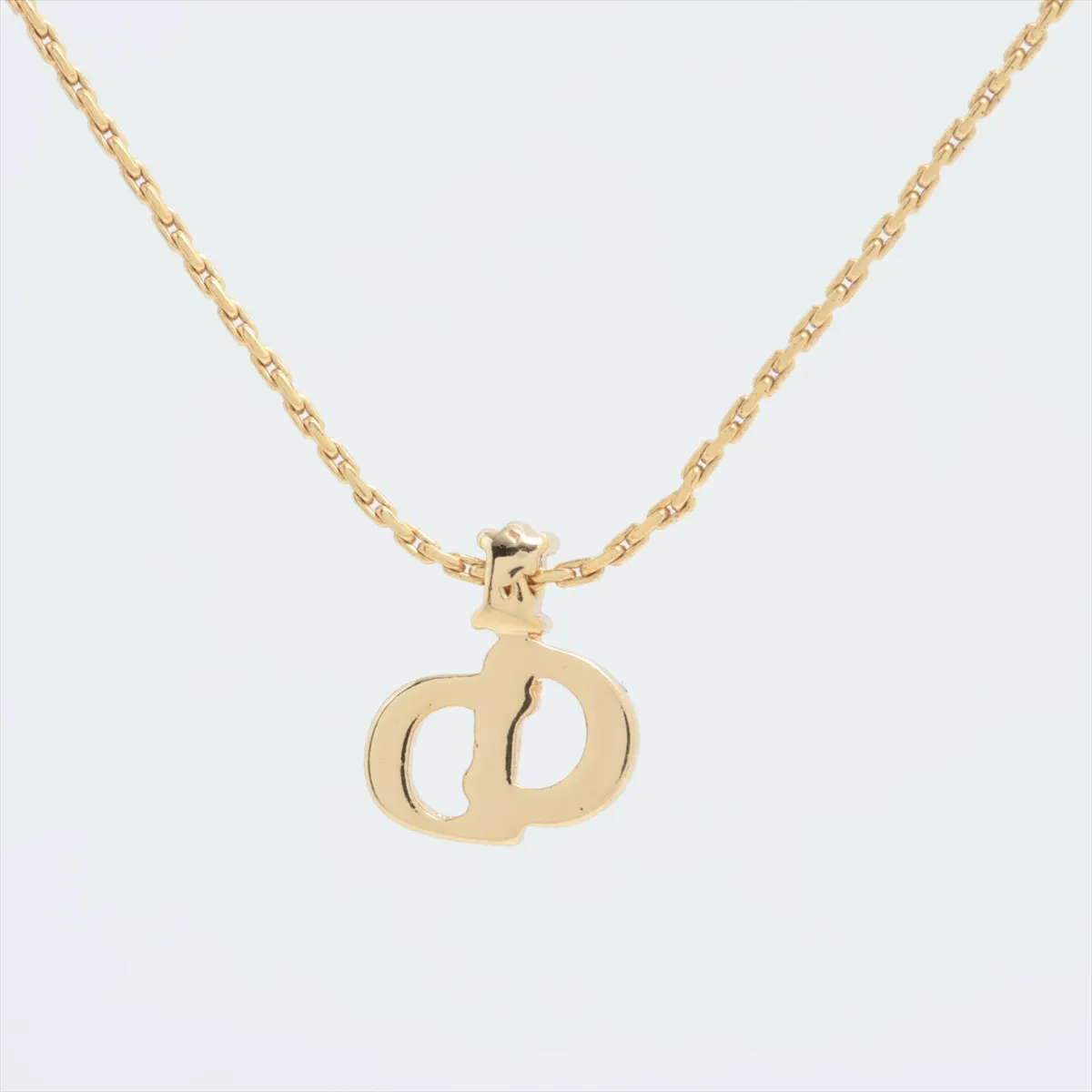 CD logo necklace, gold plated with rhinestones. Shows signs of wear, — view 2