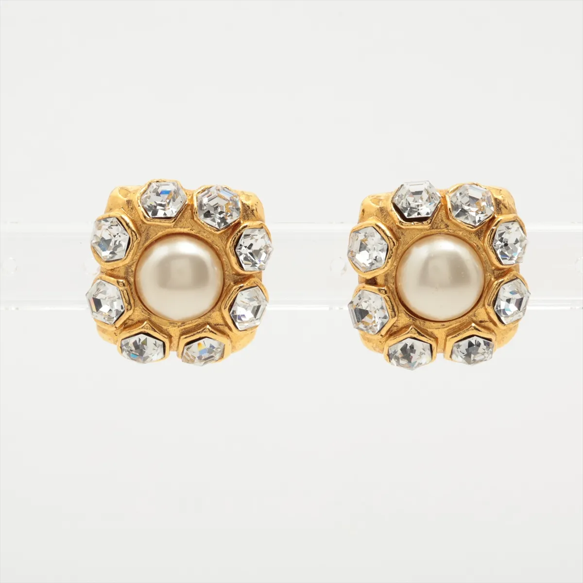 earrings (for both ears), gold-plated with rhinestones and faux pearls. Shows signs of wear, including