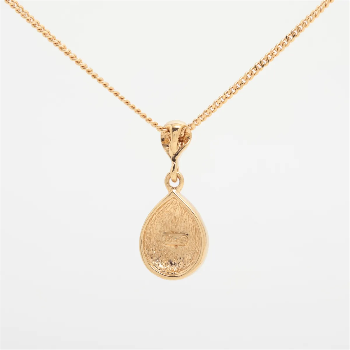necklace, gold and black, with rhinestones. Shows signs of wear, tarnish, and stains. — view 2