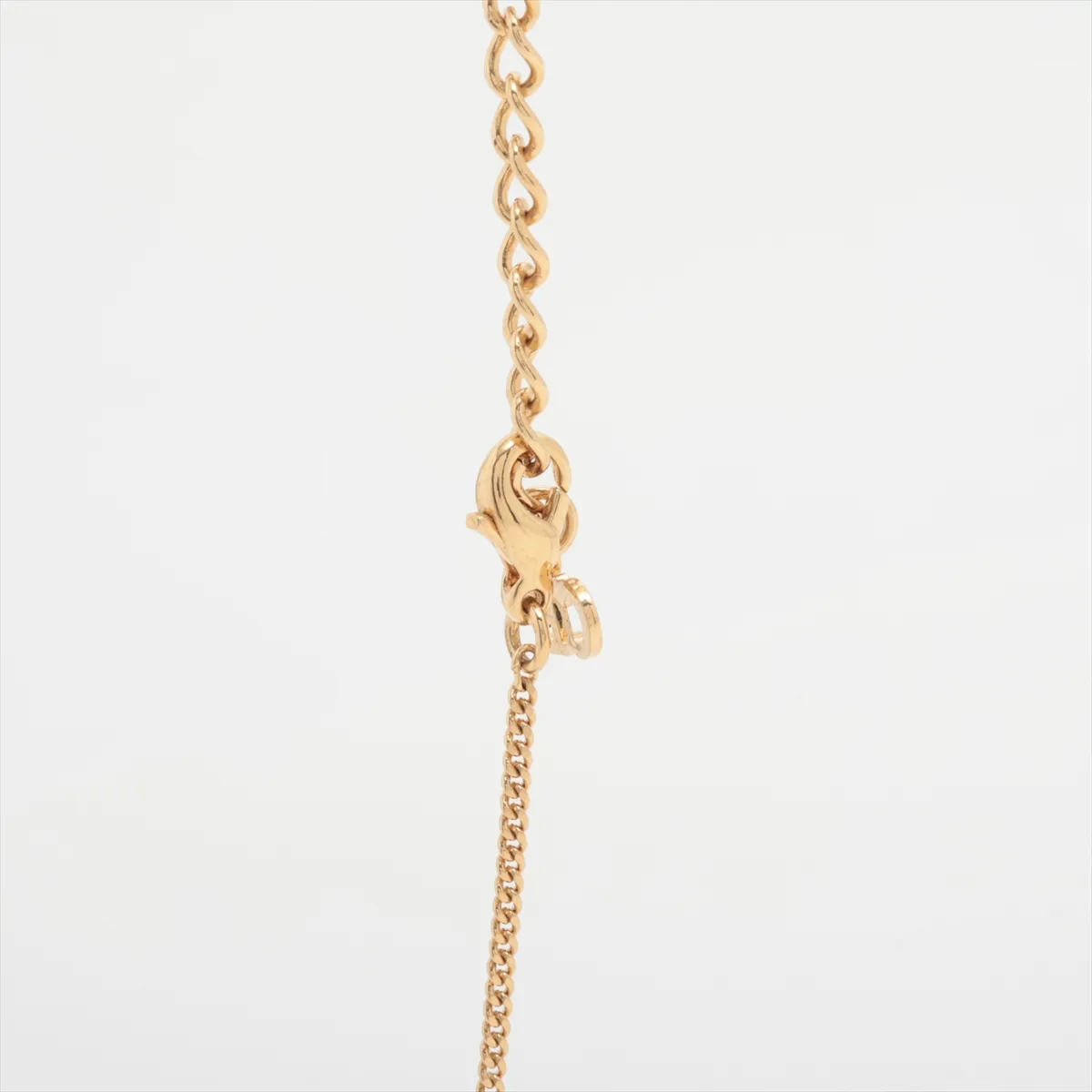 necklace, gold and black, with rhinestones. Shows signs of wear, tarnish, and stains. — view 3