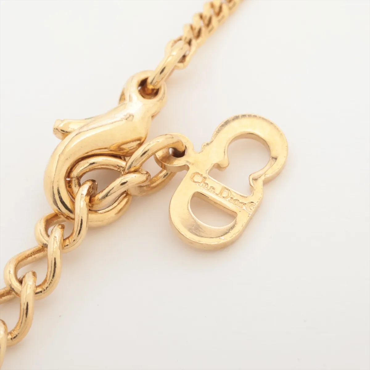 necklace, gold and black, with rhinestones. Shows signs of wear, tarnish, and stains. — view 4