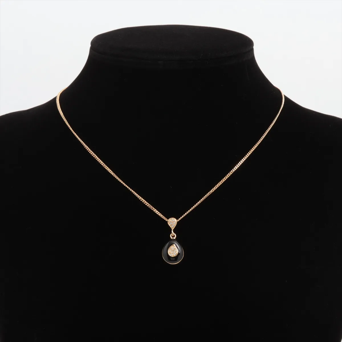 necklace, gold and black, with rhinestones. Shows signs of wear, tarnish, and stains. — view 5