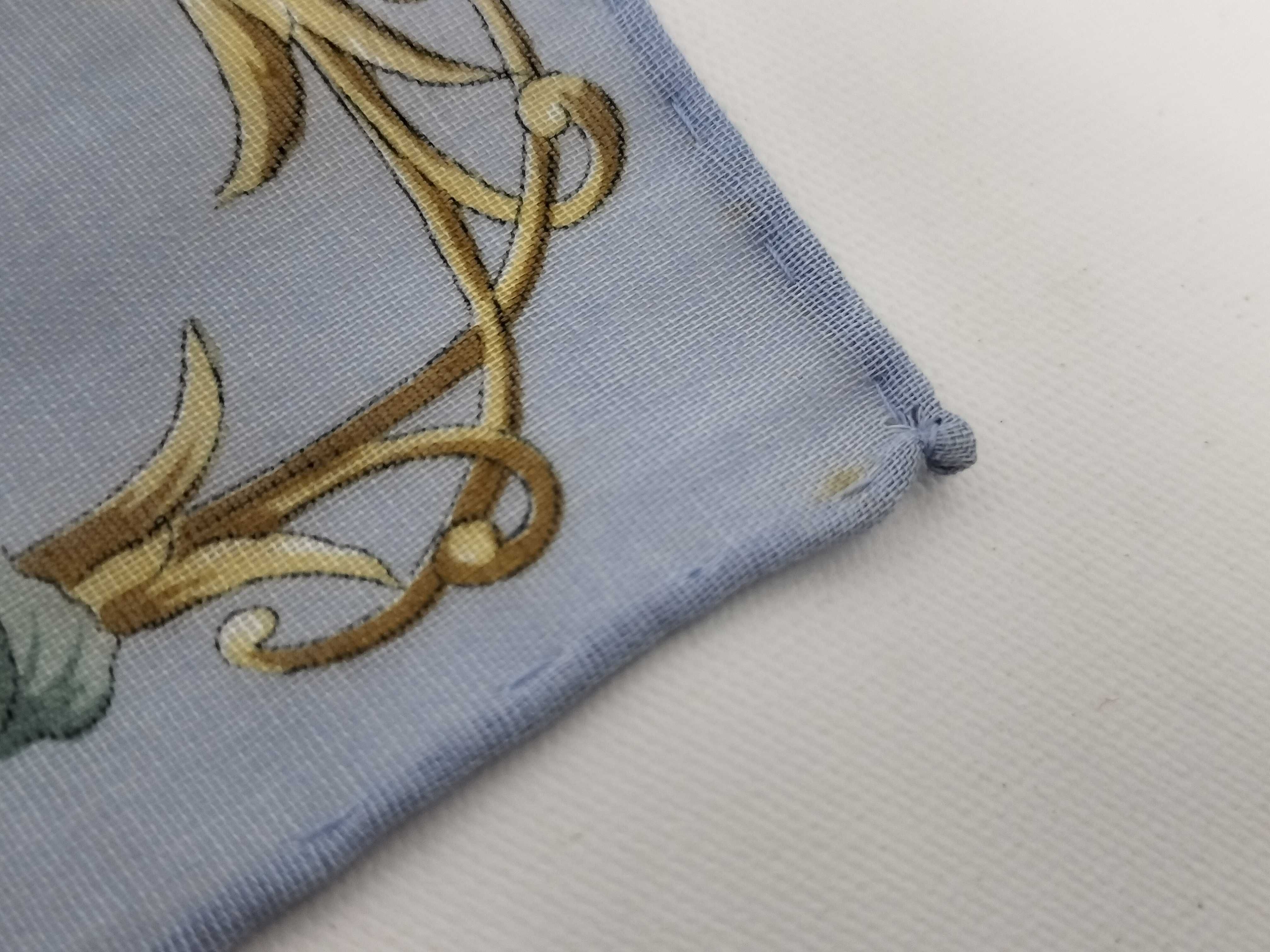 handkerchief scarf with sticker, floral design, and other accessories. — view 4