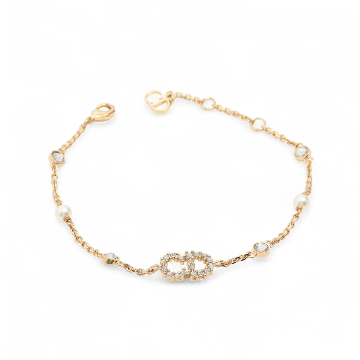 Clair D Lune bracelet, gold-plated with rhinestones and faux pearls. Shows signs of wear,