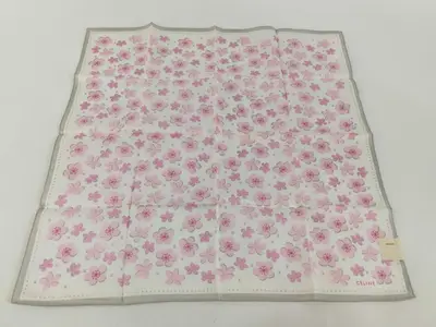 handkerchief/scarf with seal box, logo, Macadam pattern, cherry blossom design, silver glitter, and other accessories.