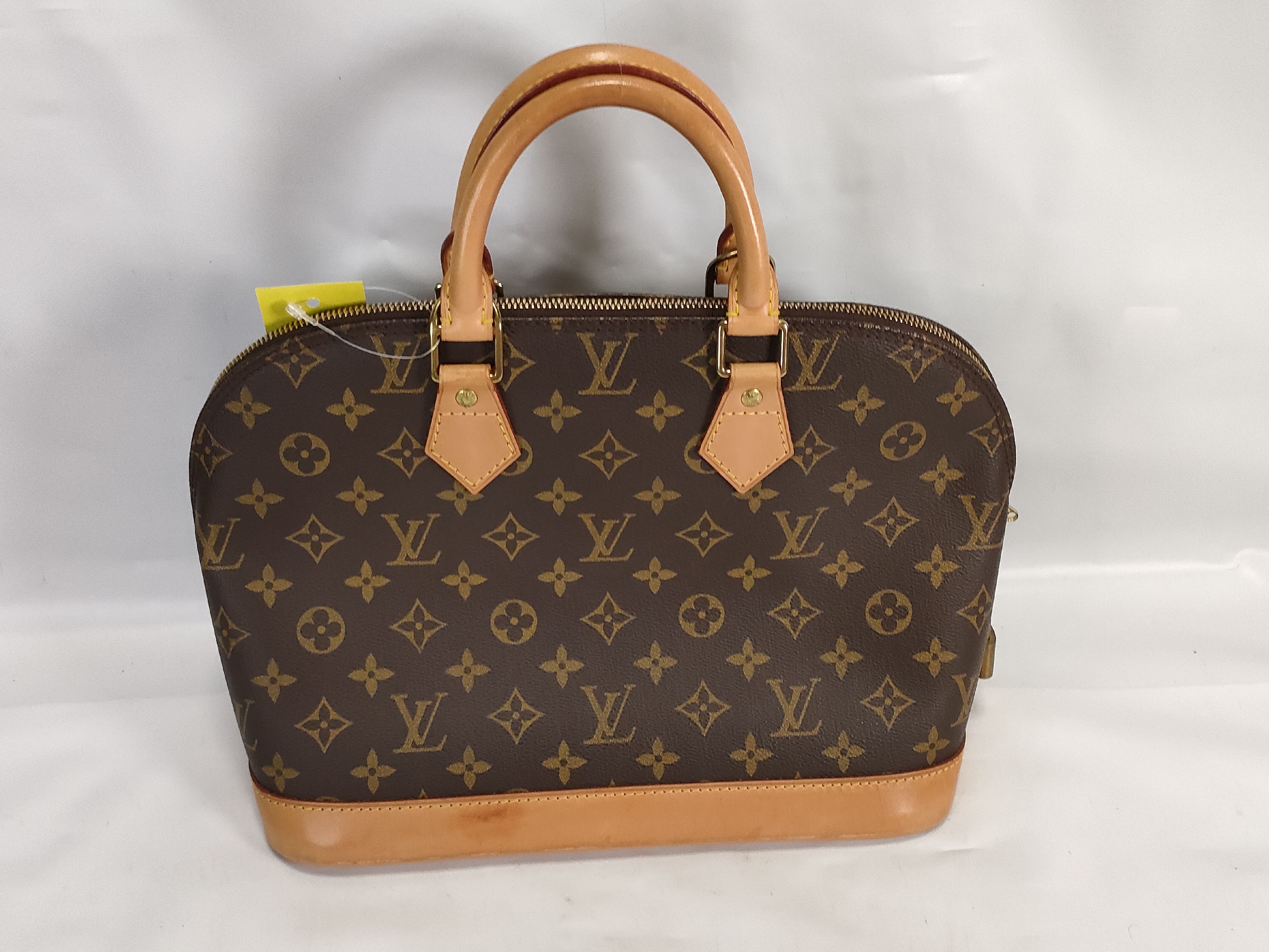 Monogram M40878 Alma MM Handbag