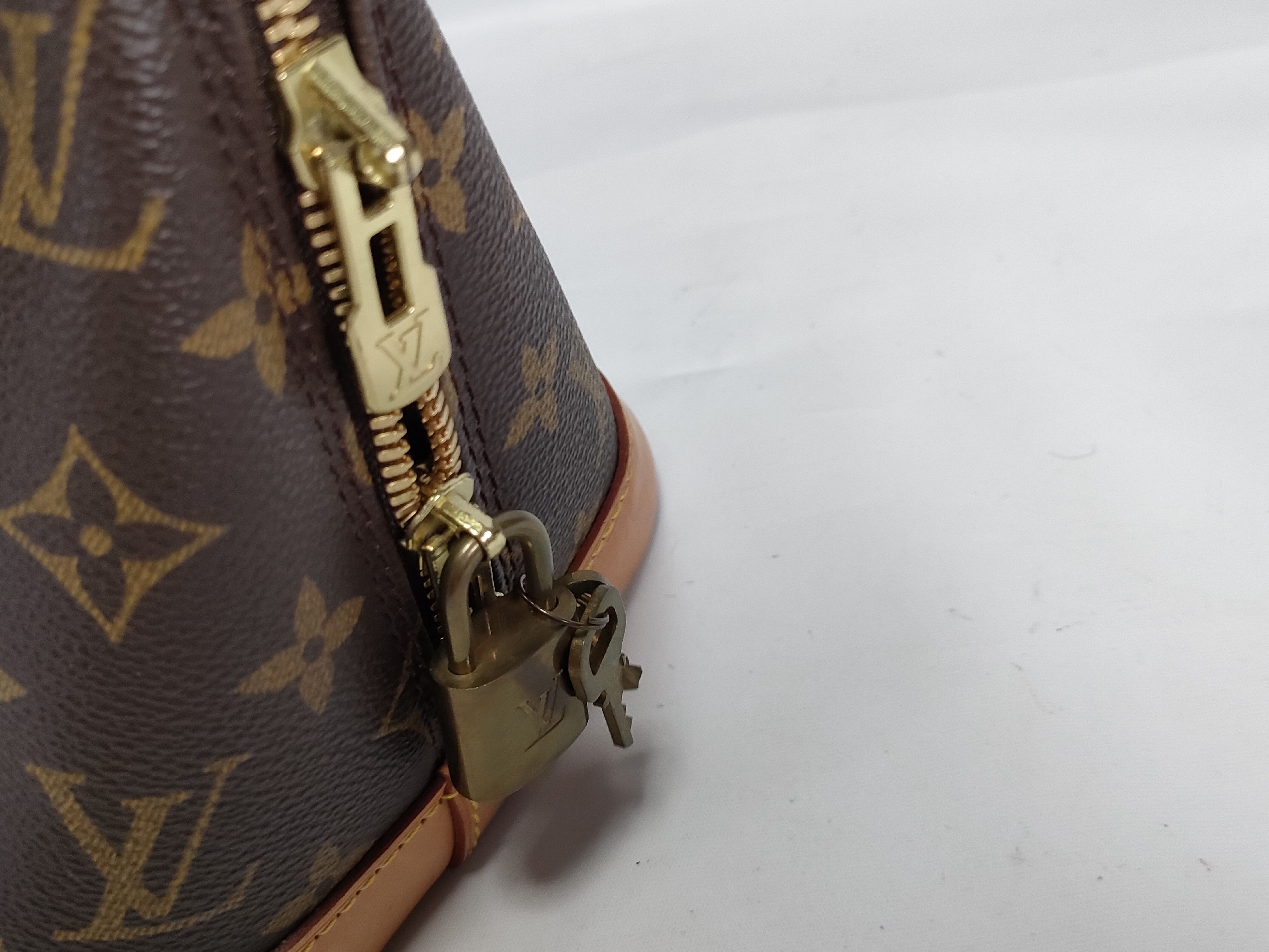 Monogram M40878 Alma MM Handbag — view 9